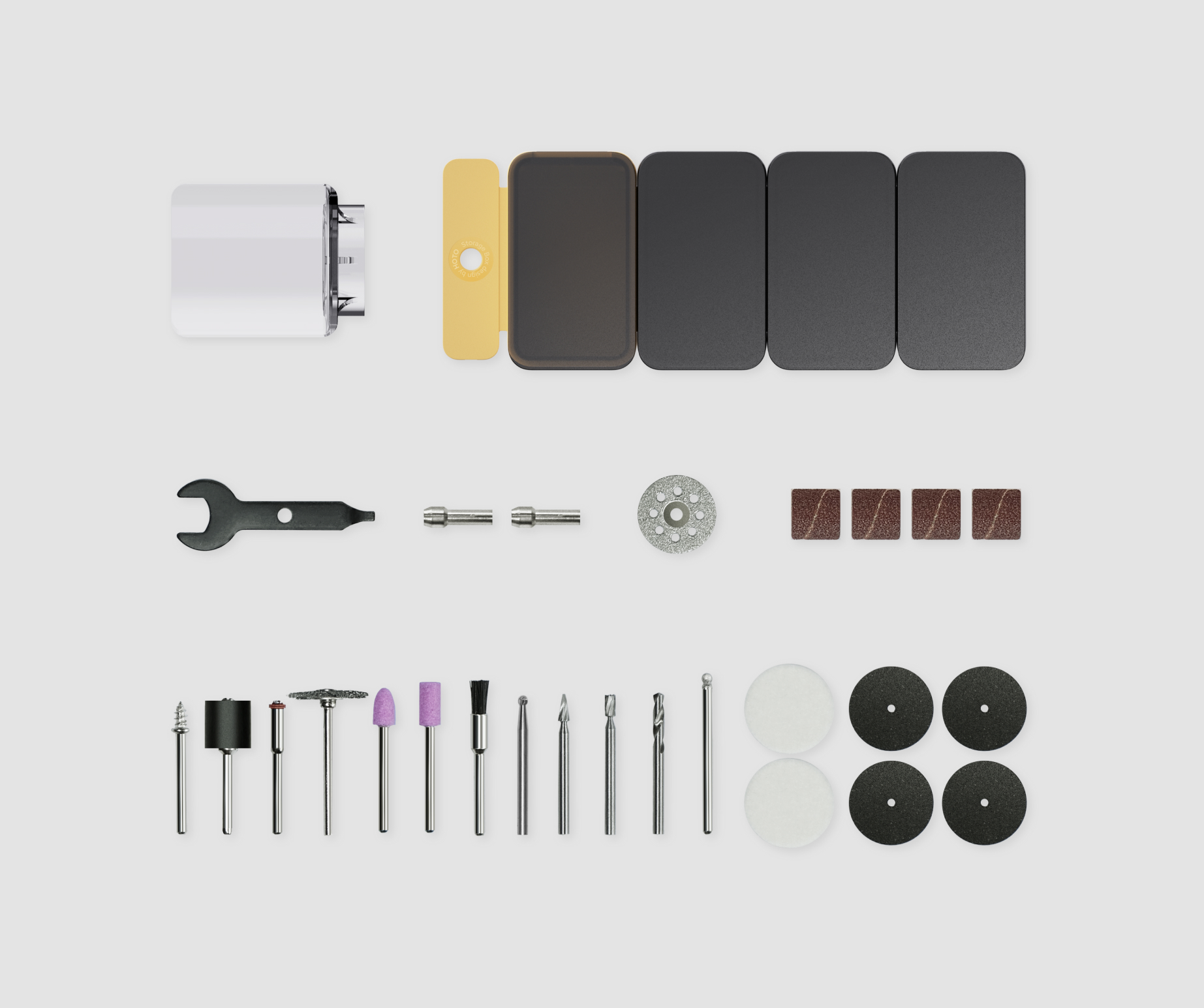 Eine Sammlung von Werkzeugen, darunter Bohrer, ein Schraubenschlüssel und Schleifpads.