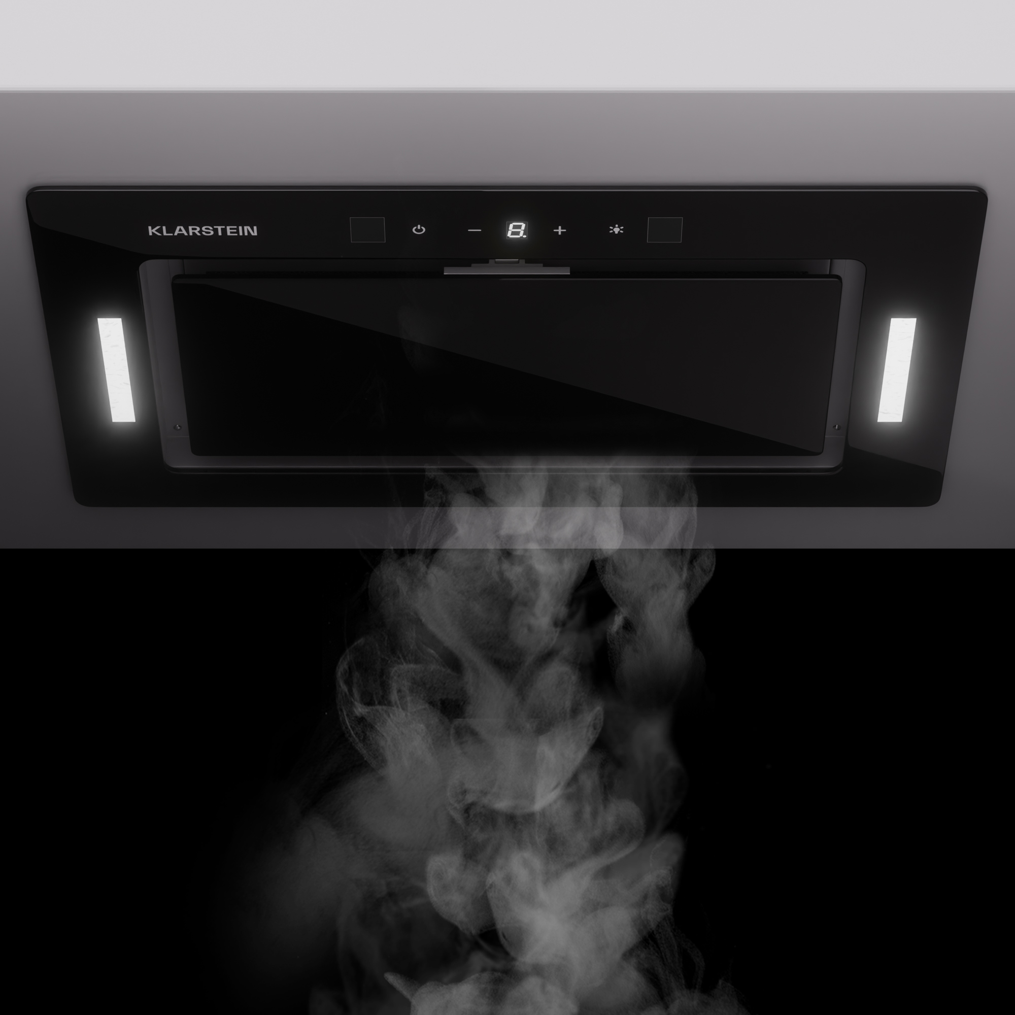 Cappa nera con luci e display digitale, sopra vapore ascendente.