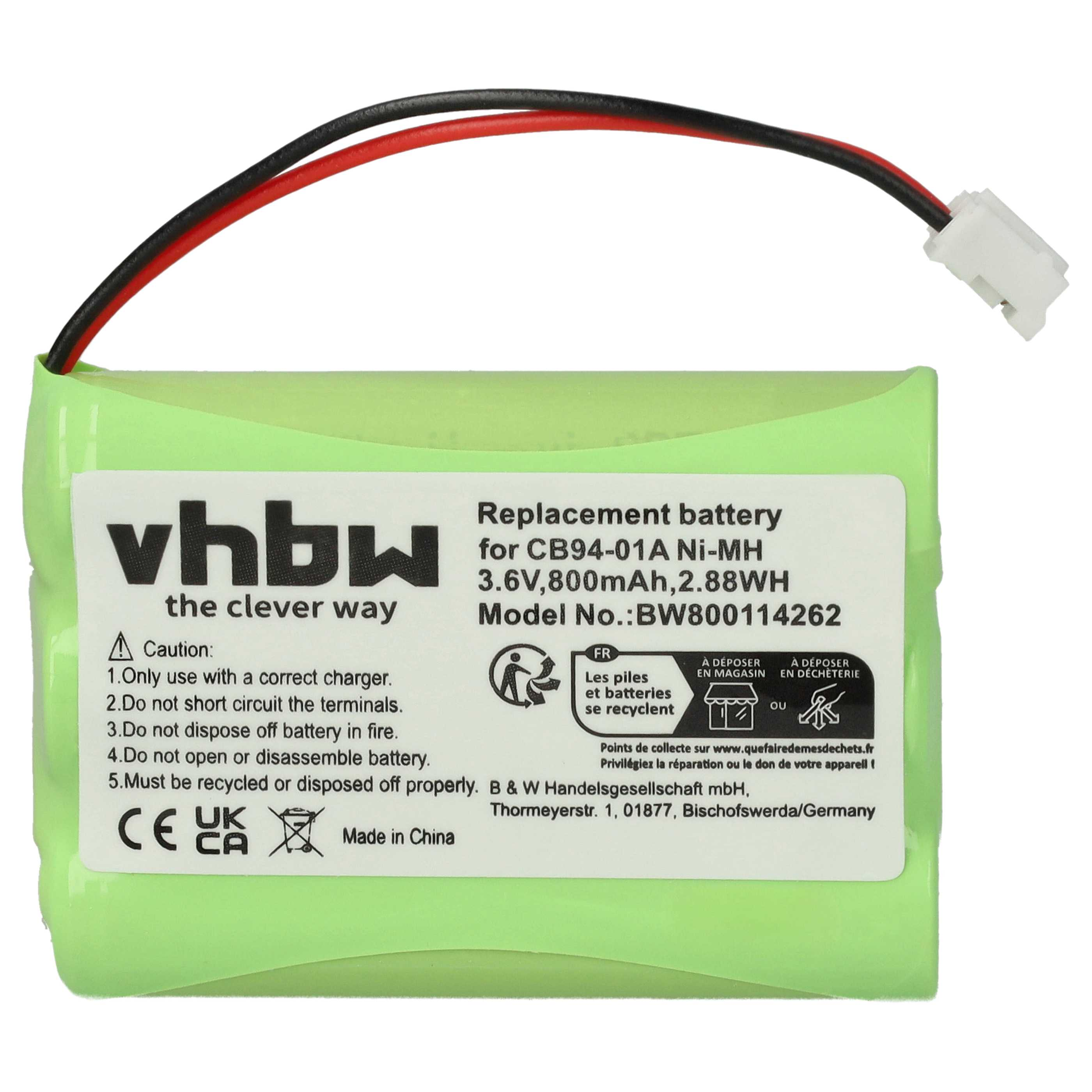 Eine grüne Ersatzbatterie mit Text und Warnhinweisen. Sie hat rote und schwarze Drähte und einen weißen Stecker.