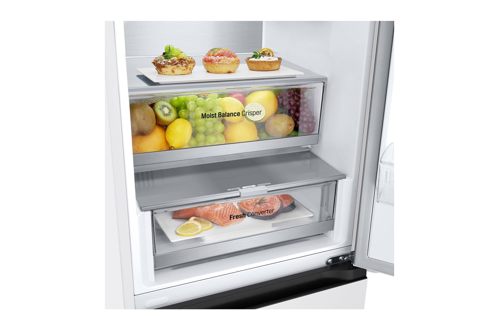 Inside a fridge, food items in drawers and on shelves. Includes fruits, vegetables, and fish with lemons.
