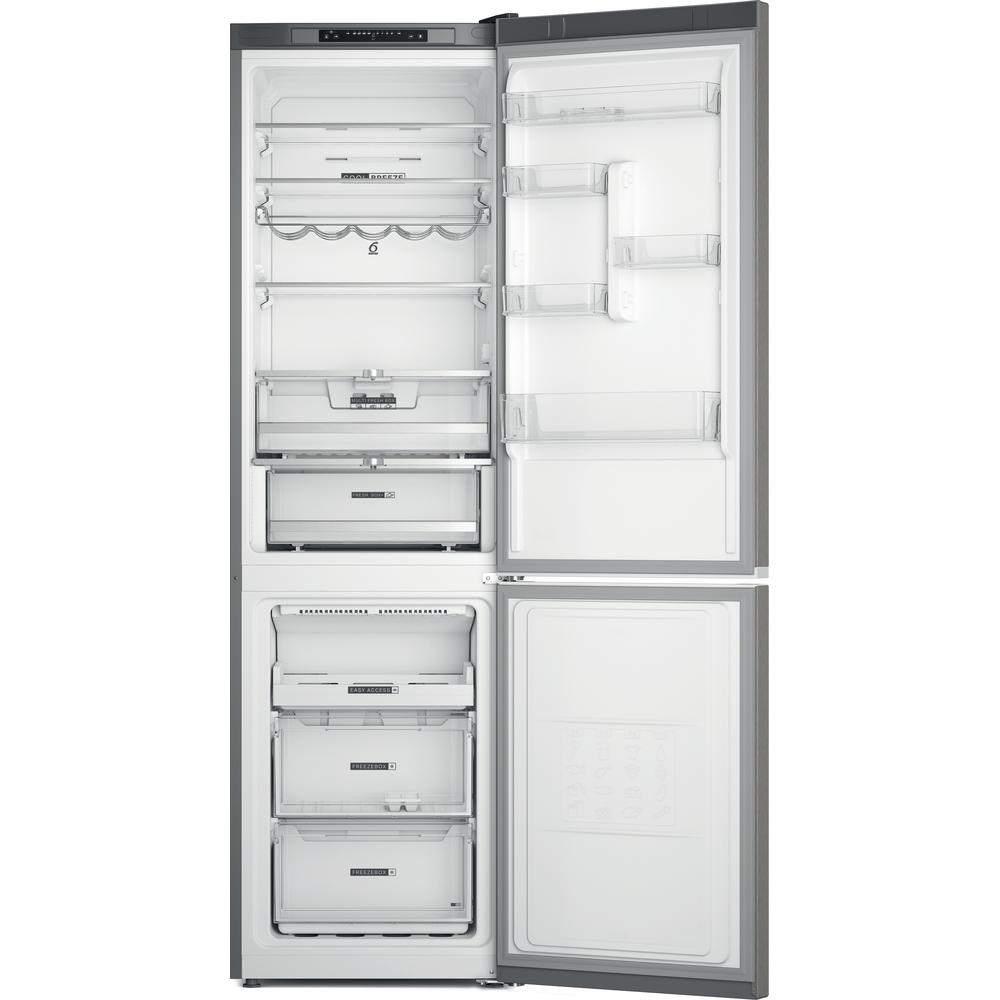 Refrigerador abierto mostrando estantes, cajones y congelador, todo vacío.
