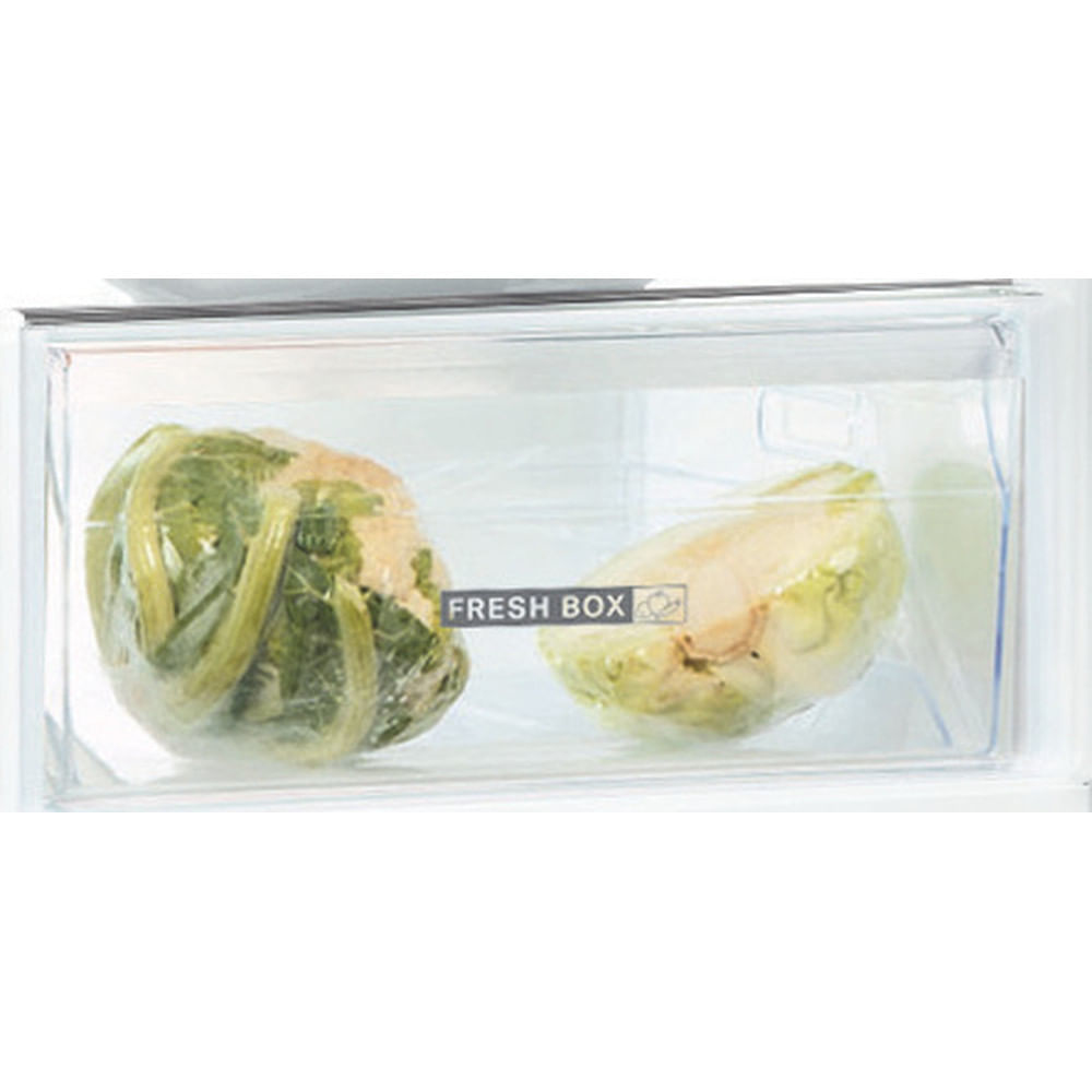 Close-up of a refrigerator drawer with packaged vegetables. Fresh box label is visible.