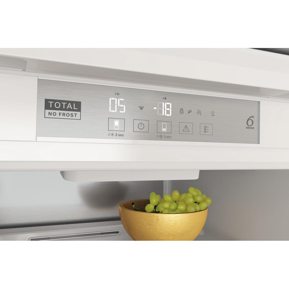 Close-up of fridge control panel. Displays temperature settings and icons.