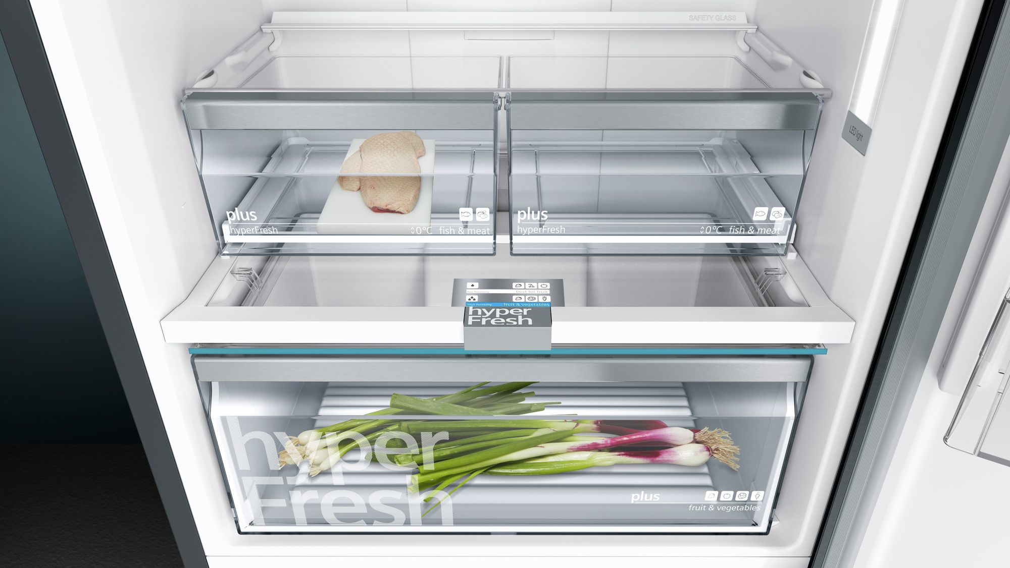 Refrigerator interior. HyperFresh drawers with food, including meat and vegetables.