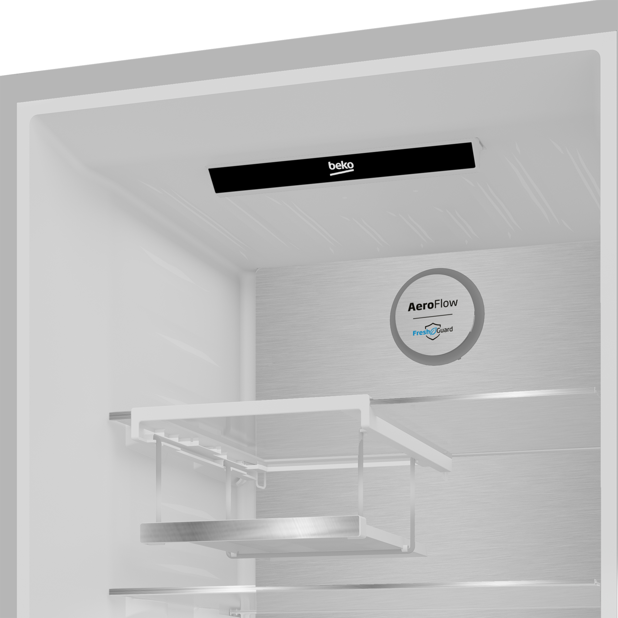 All'interno del frigorifero, con logo 'beko', ripiani e testo 'AeroFlow FreshGuard'.