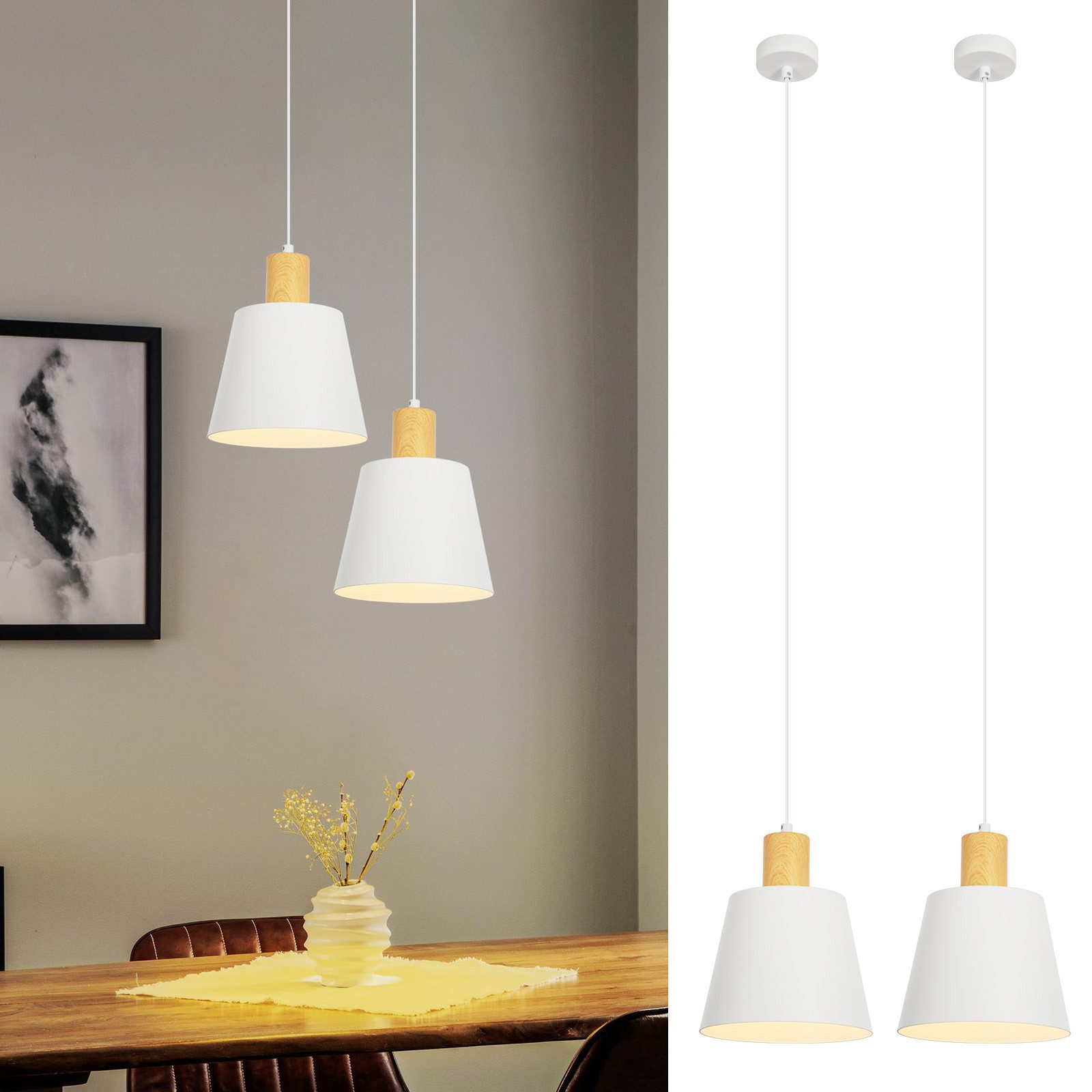 Due lampade a sospensione bianche con accenti in legno appese sopra un tavolo di legno. Un dipinto sul muro.