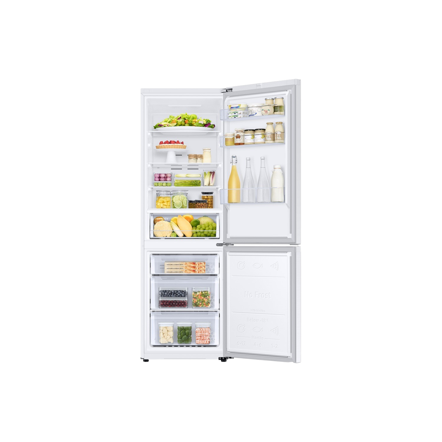 White refrigerator open, filled with food. Fruits, vegetables, and other items are visible in the fridge.