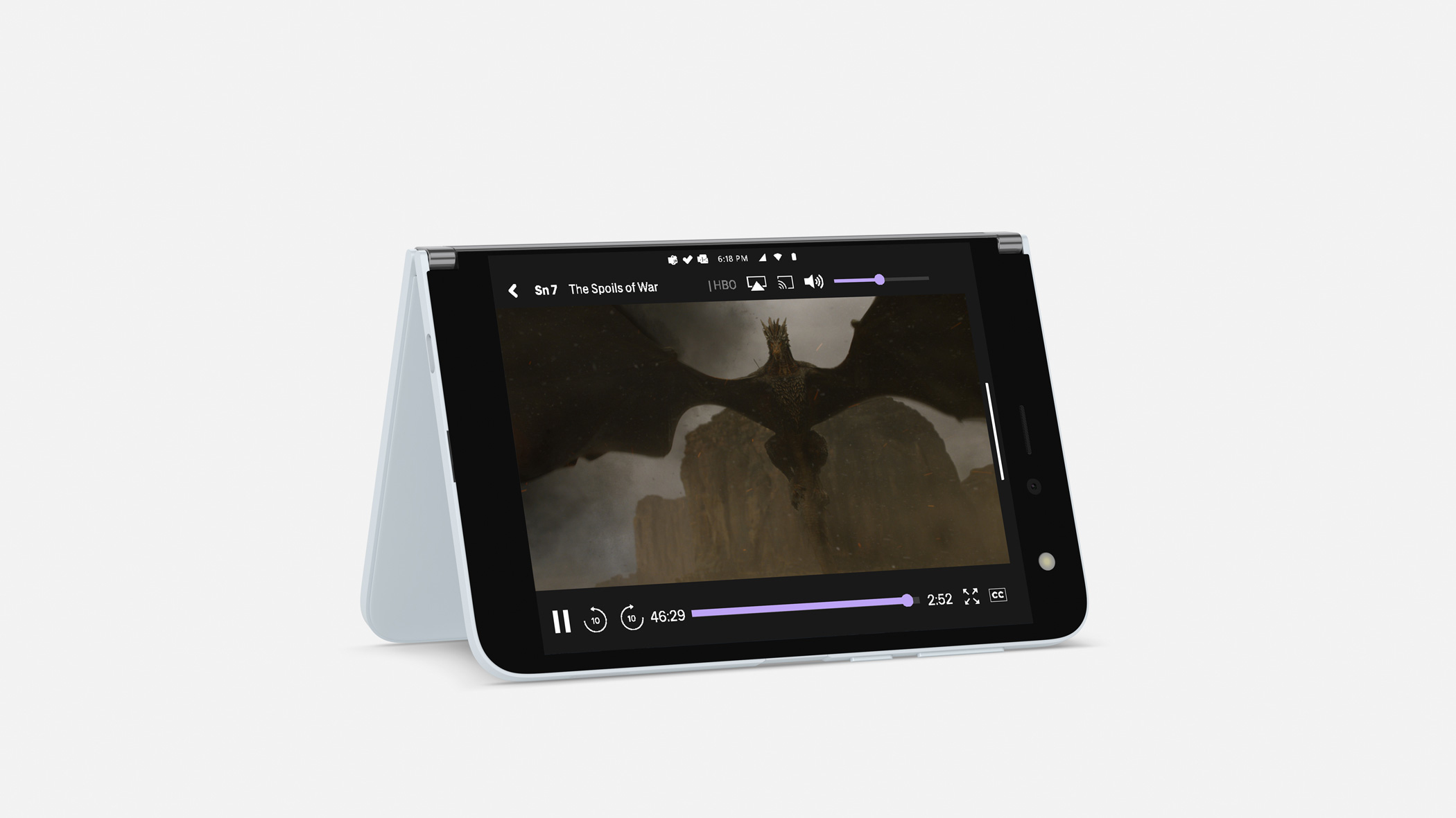 Tablet mit einem Film, der einen Drachen zeigt, der über eine Landschaft fliegt.