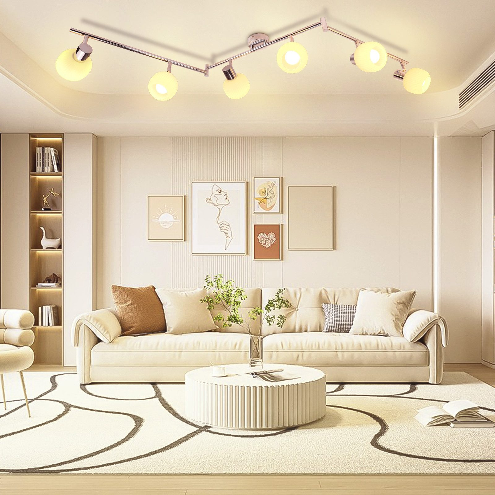 Nowoczesny salon z sofą, sztuką i systemem oświetlenia szynowego z wieloma żarówkami.