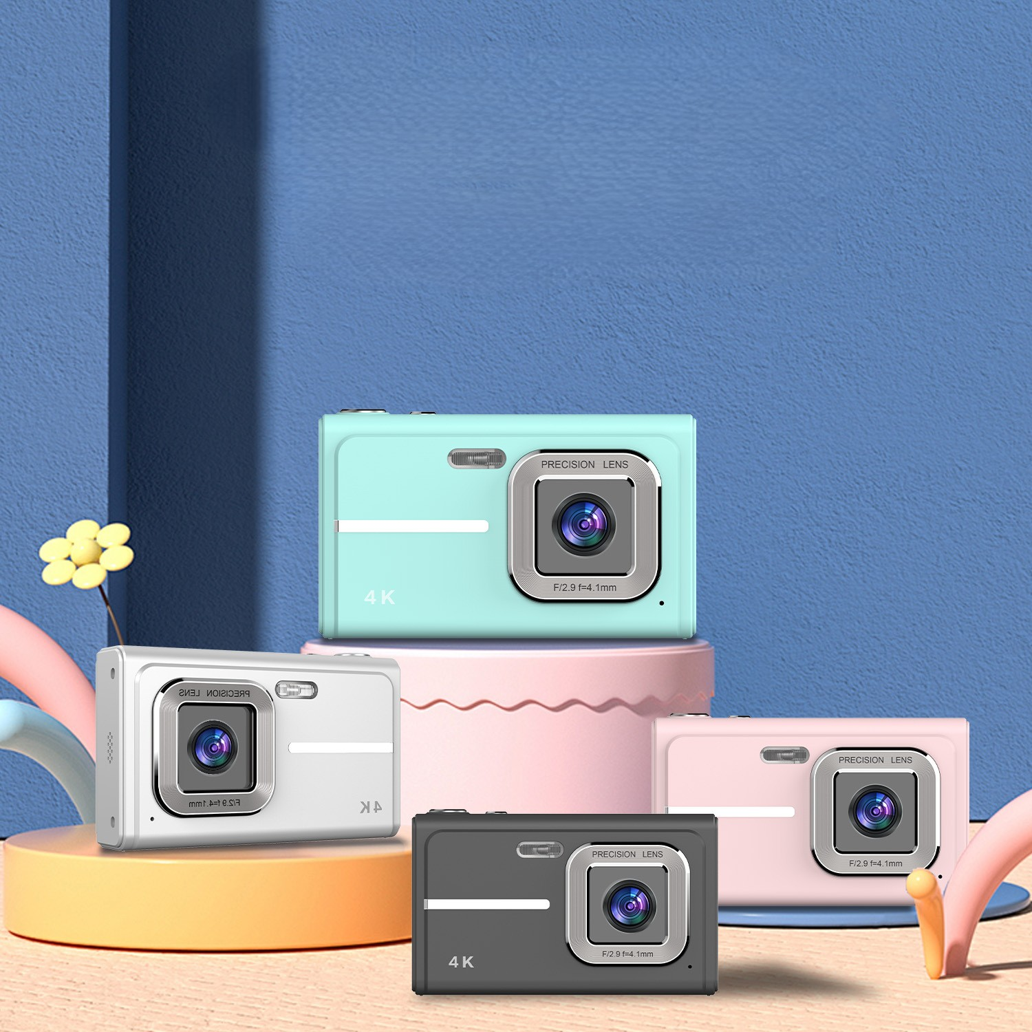 Vier farbige Kameras auf einem Ständer. Mint, weiß, schwarz und rosa. Sie haben Objektive.