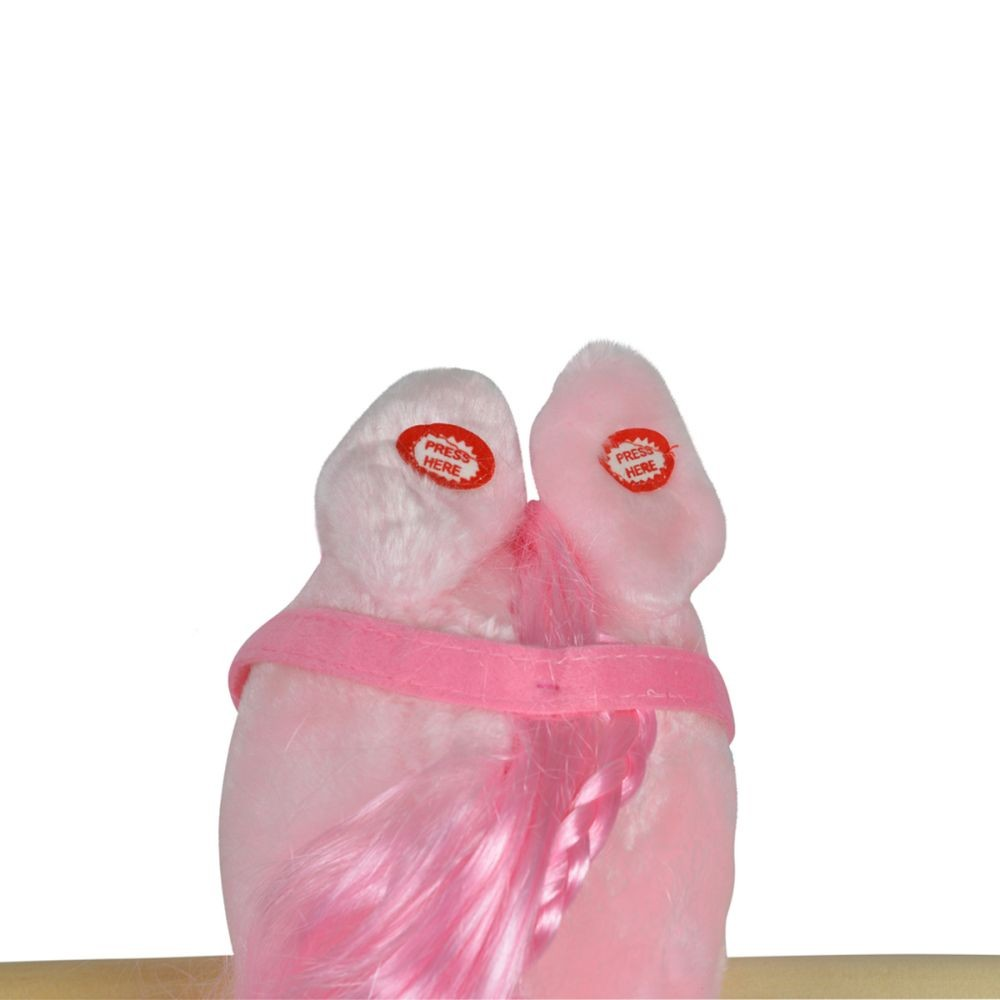 Ein rosa Stofftier mit rosa Haaren und zwei Ohren mit den Worten 'DRÜCK HIER'. Rosa Kragen.
