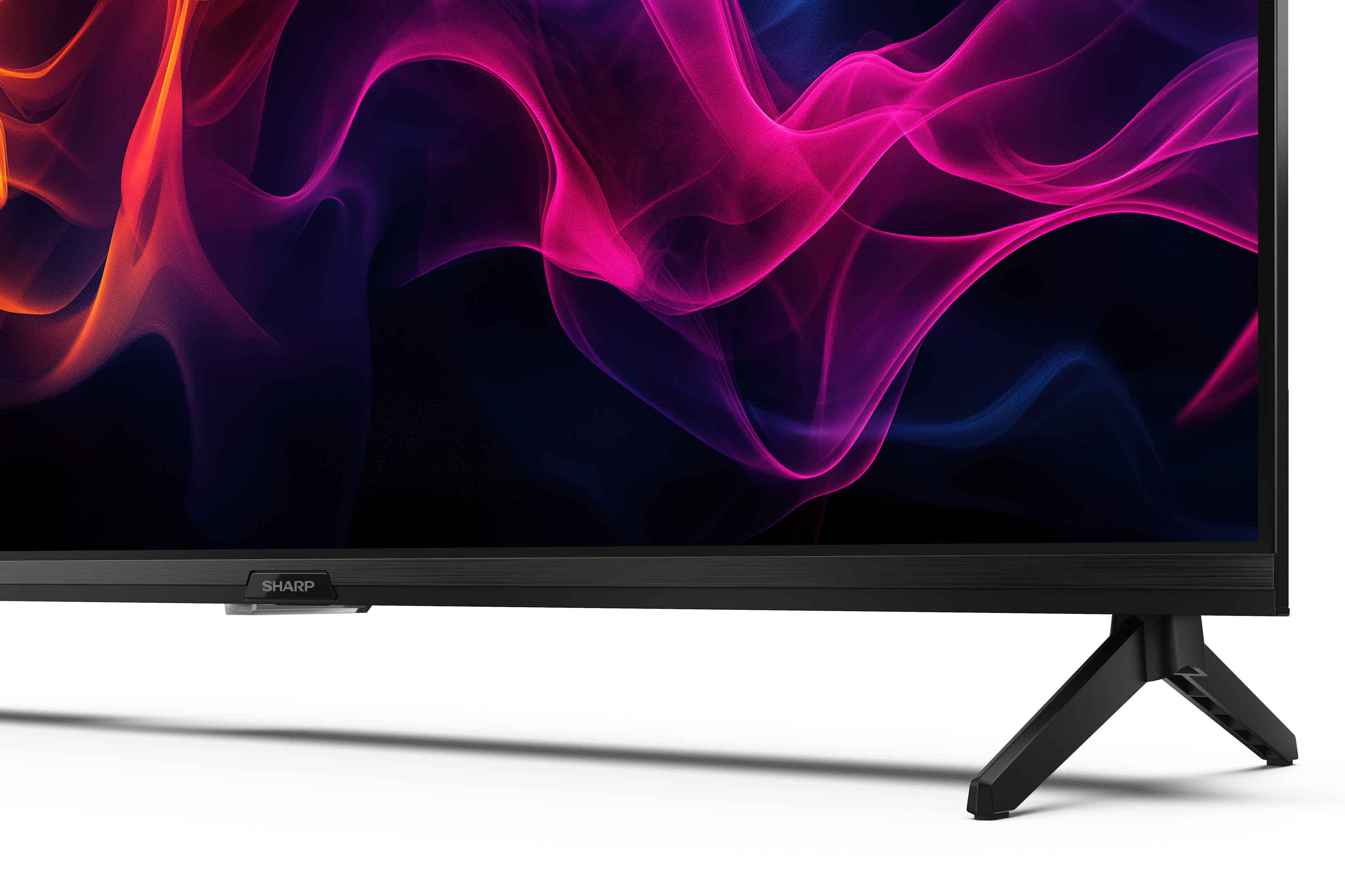 Uno schermo TV nero con motivi astratti colorati e un supporto nero. Il logo Sharp è visibile.