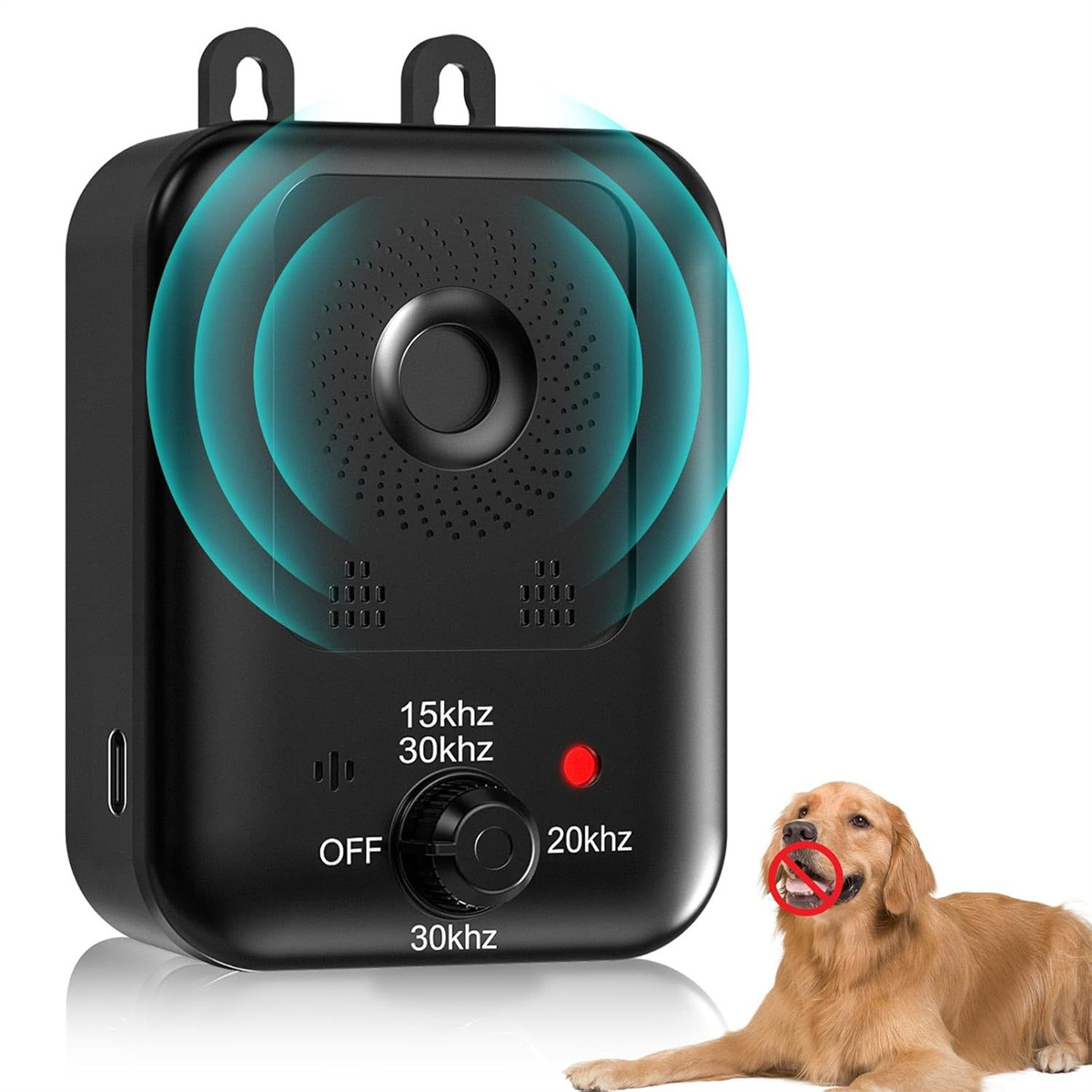 Schwarzes Gerät mit Hund. Das Gerät sendet Schallwellen aus. Der Hund hat ein rotes Spielzeug im Maul.