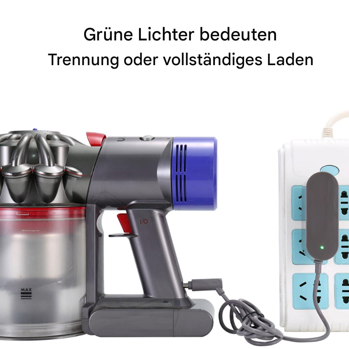 Staubsauger und Ladestation. Grünes Licht zeigt volle Ladung oder Trennung an.