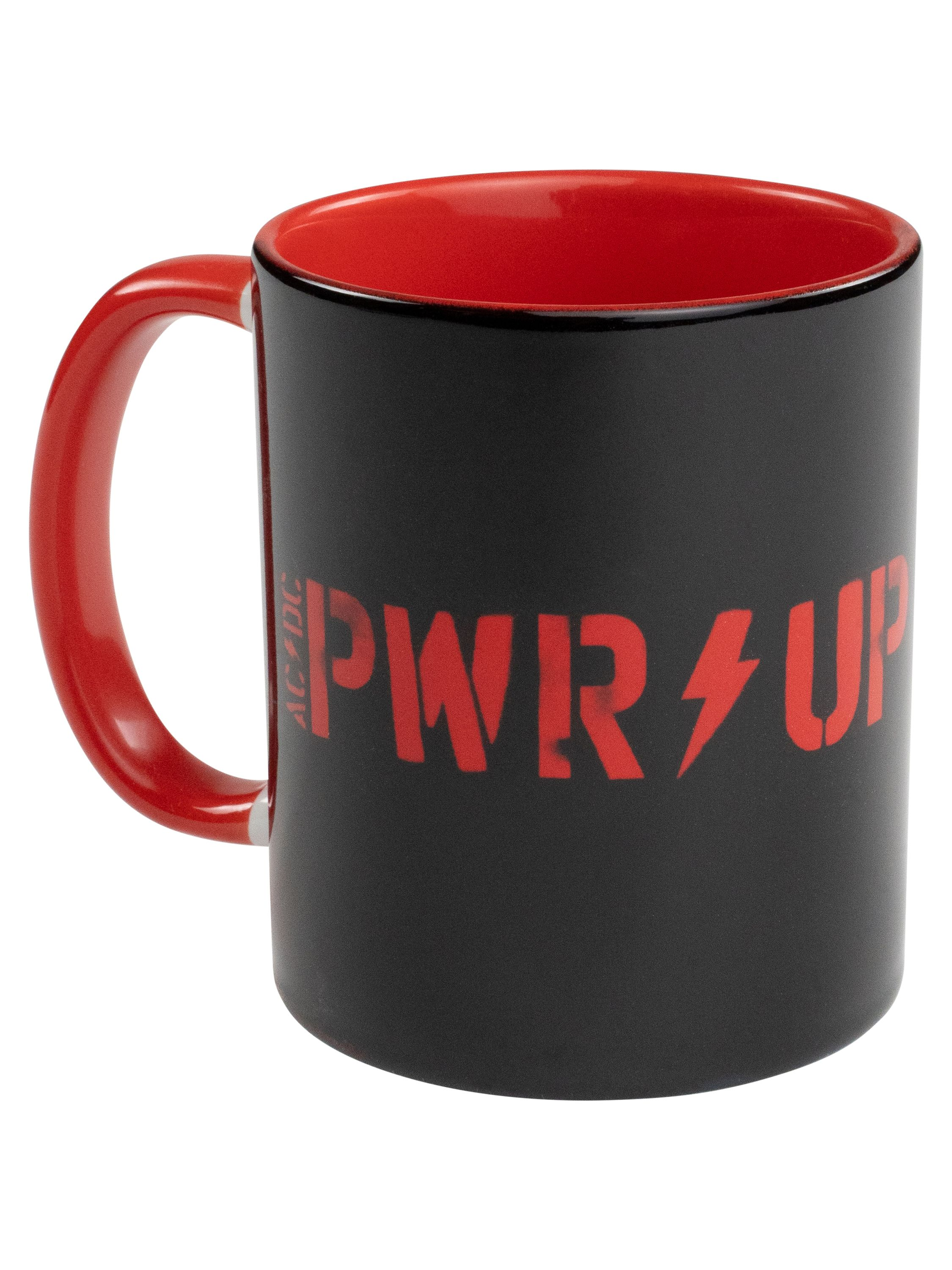 Schwarze Tasse mit roter Innenseite und AC/DC PWR UP Logo.