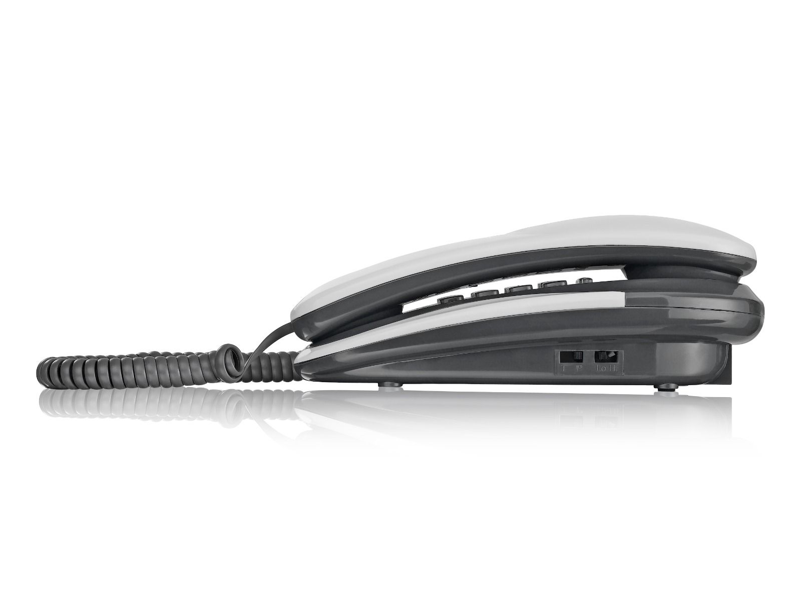 Telefono fisso bianco e grigio, vista laterale, su una superficie bianca. Il cavo è arrotolato, ombra presente.