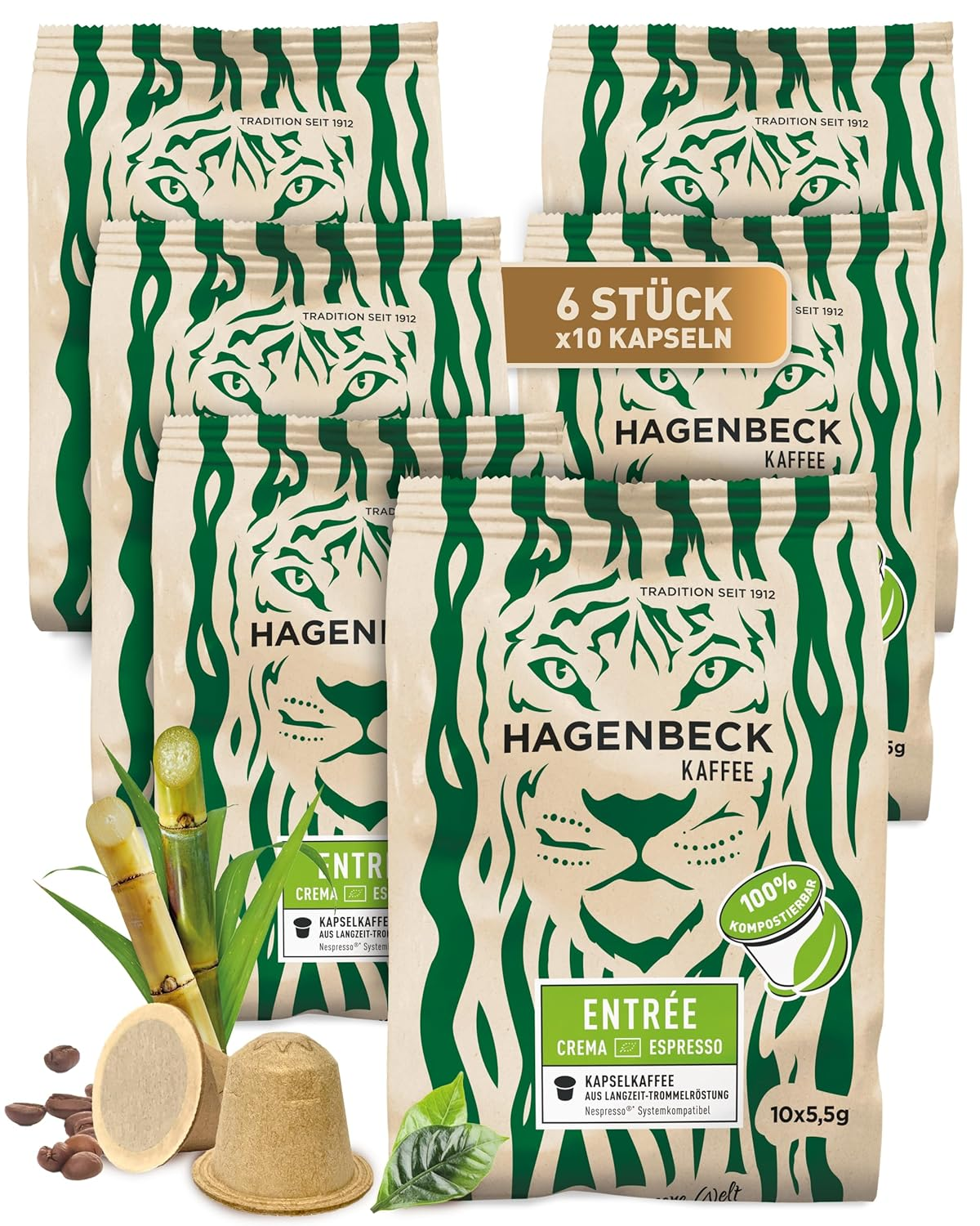 Sechs Packungen Kaffeekapseln mit grün-weißer Verpackung, einige Kapseln und Pflanzen.
