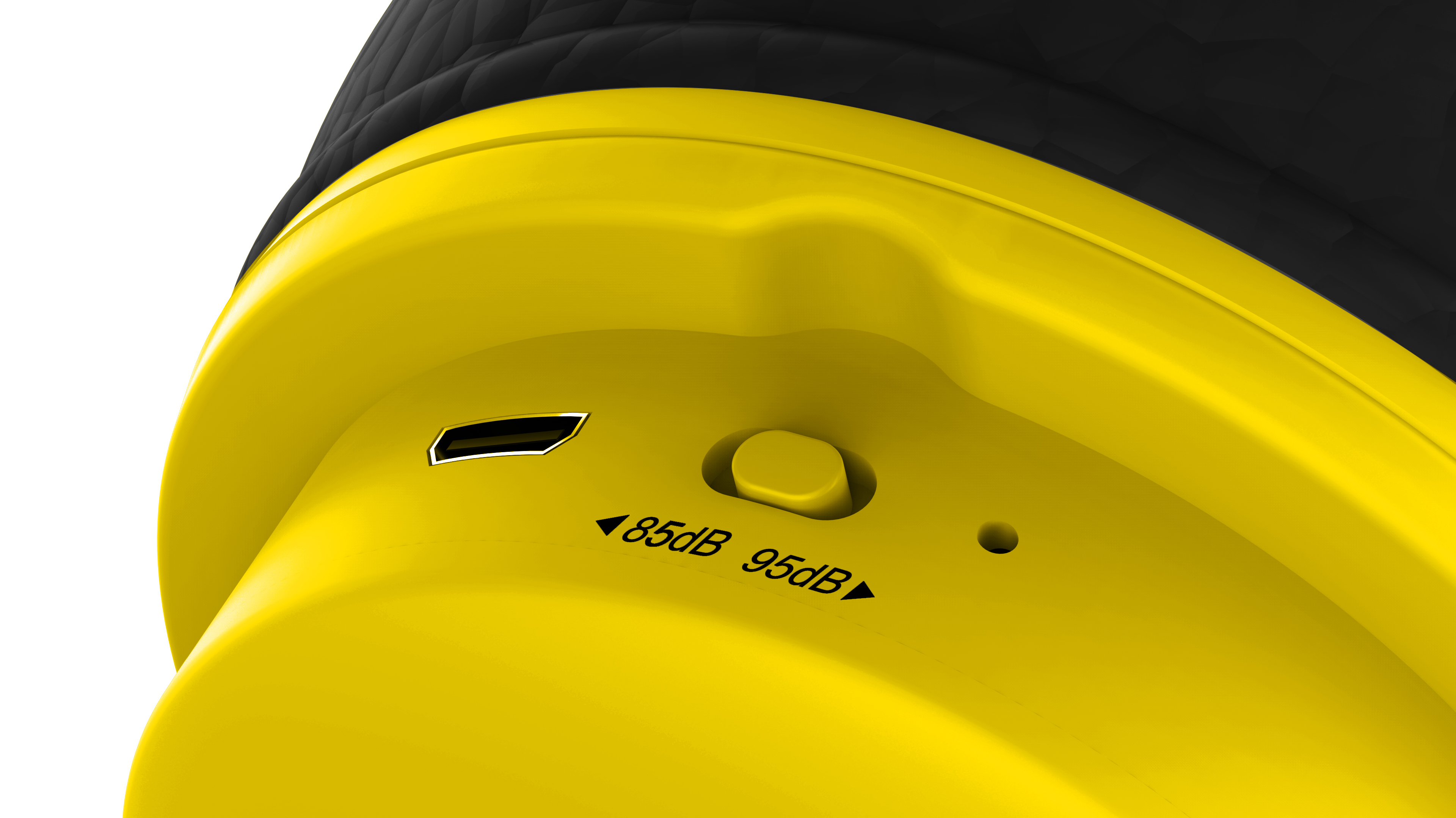 Gele koptelefoon close-up. Een USB-poort, volumeknop en markeringen (85dB/95dB) zijn zichtbaar.