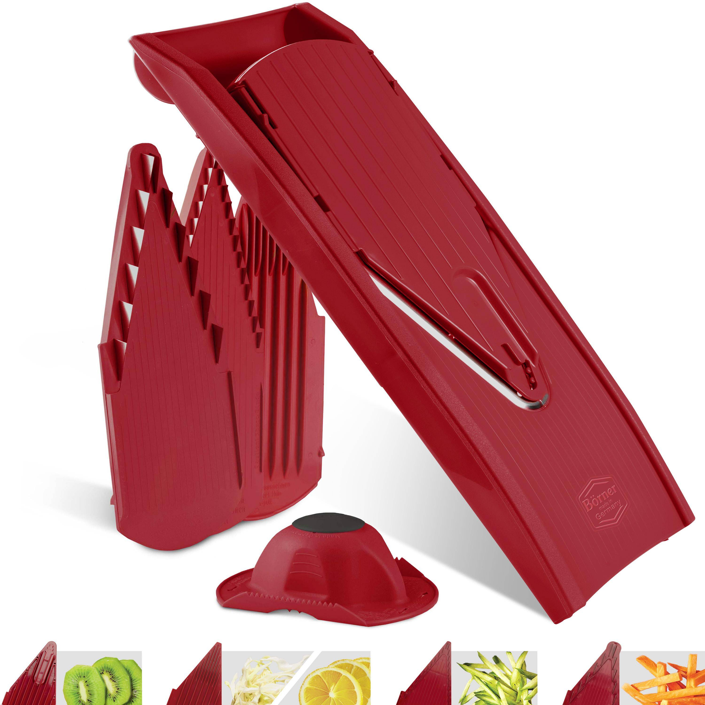 Roter Schneider mit mehreren Klingen, Sockel und Lebensmittelhaltern. Geschnittene Kiwi, Zitrone und Karotte sind sichtbar.