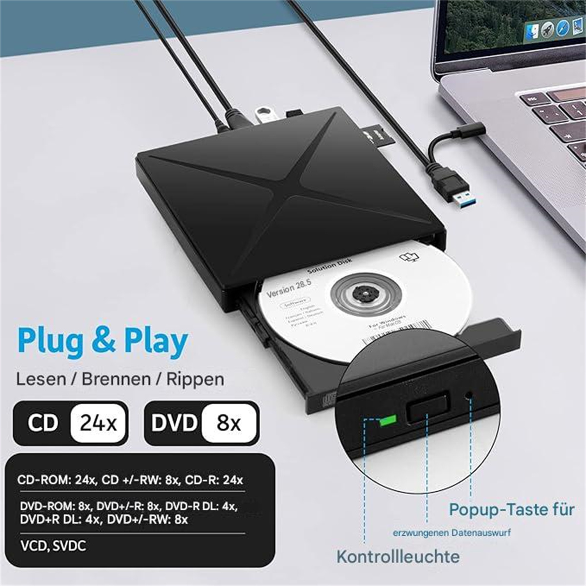 Schwarzes DVD/CD-Laufwerk mit eingelegter Disc, Etikett sichtbar, USB-Kabel am Laptop.