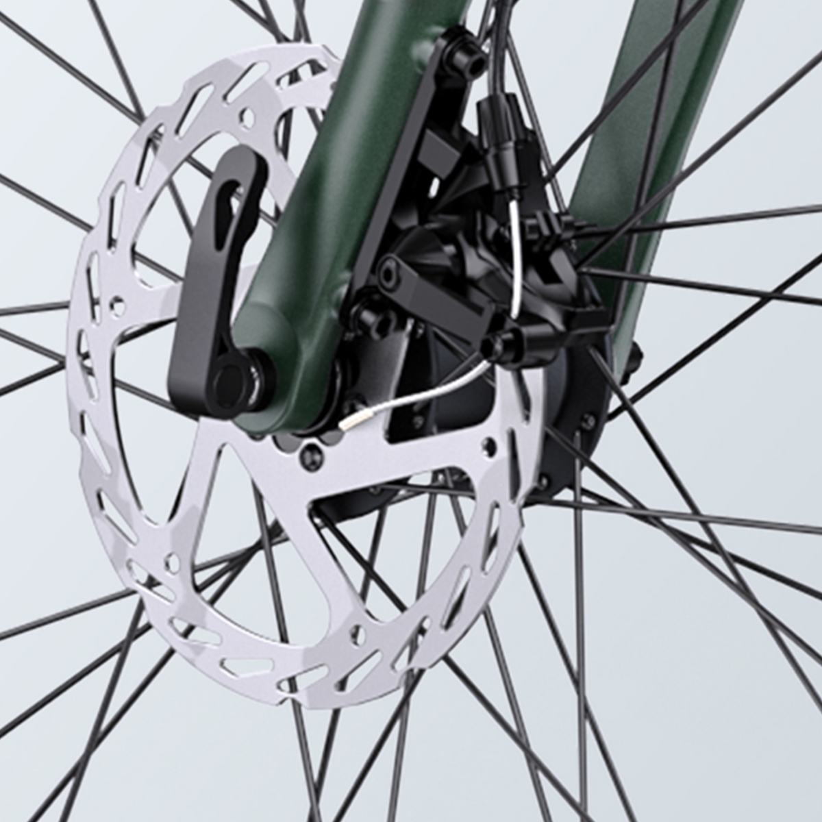 Koło rowerowe z hamulcami tarczowymi. Hamulec jest czarny.