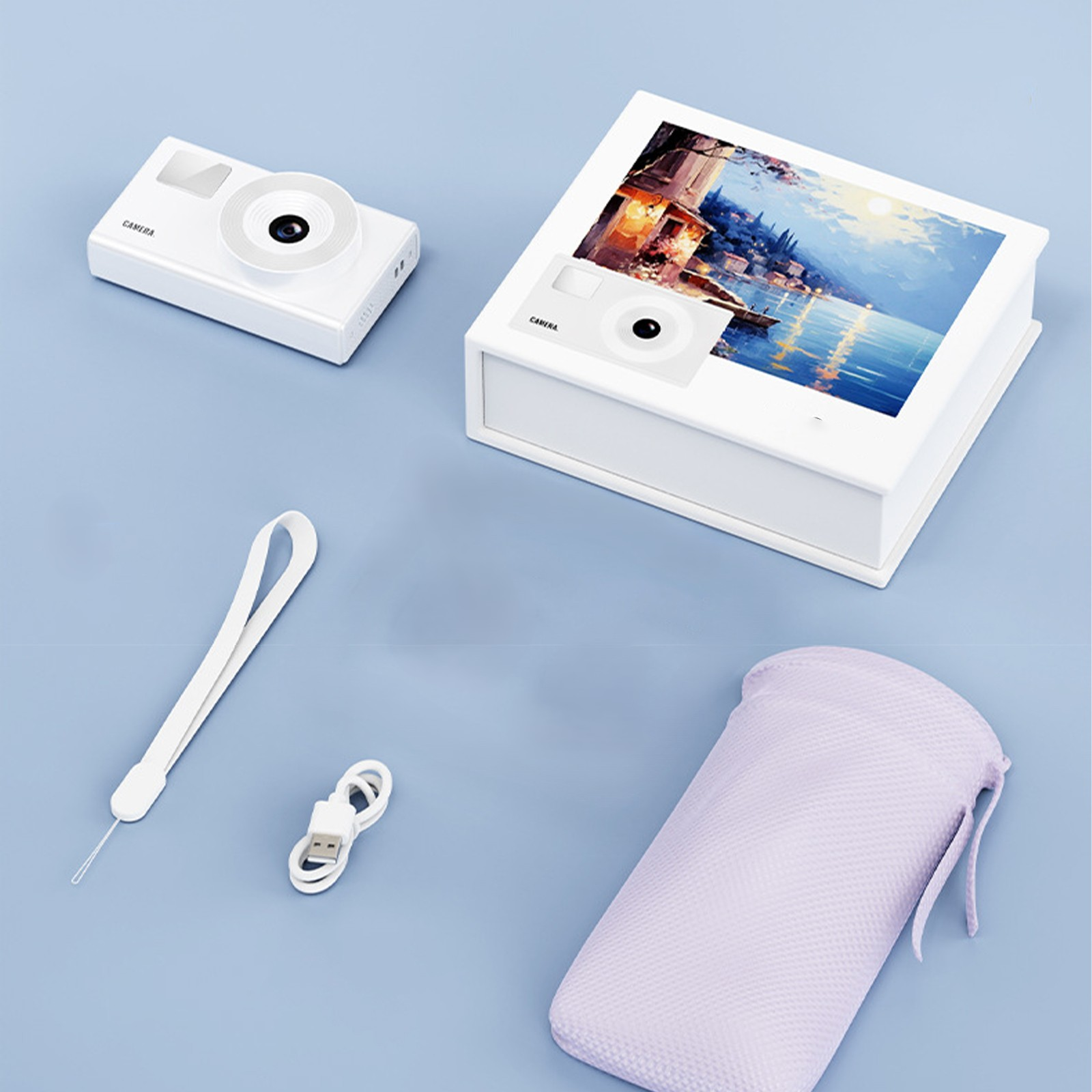 Weiße Kamera und Box mit Bildschirm. Zubehör umfasst einen Gurt, ein Kabel und einen lila Beutel.