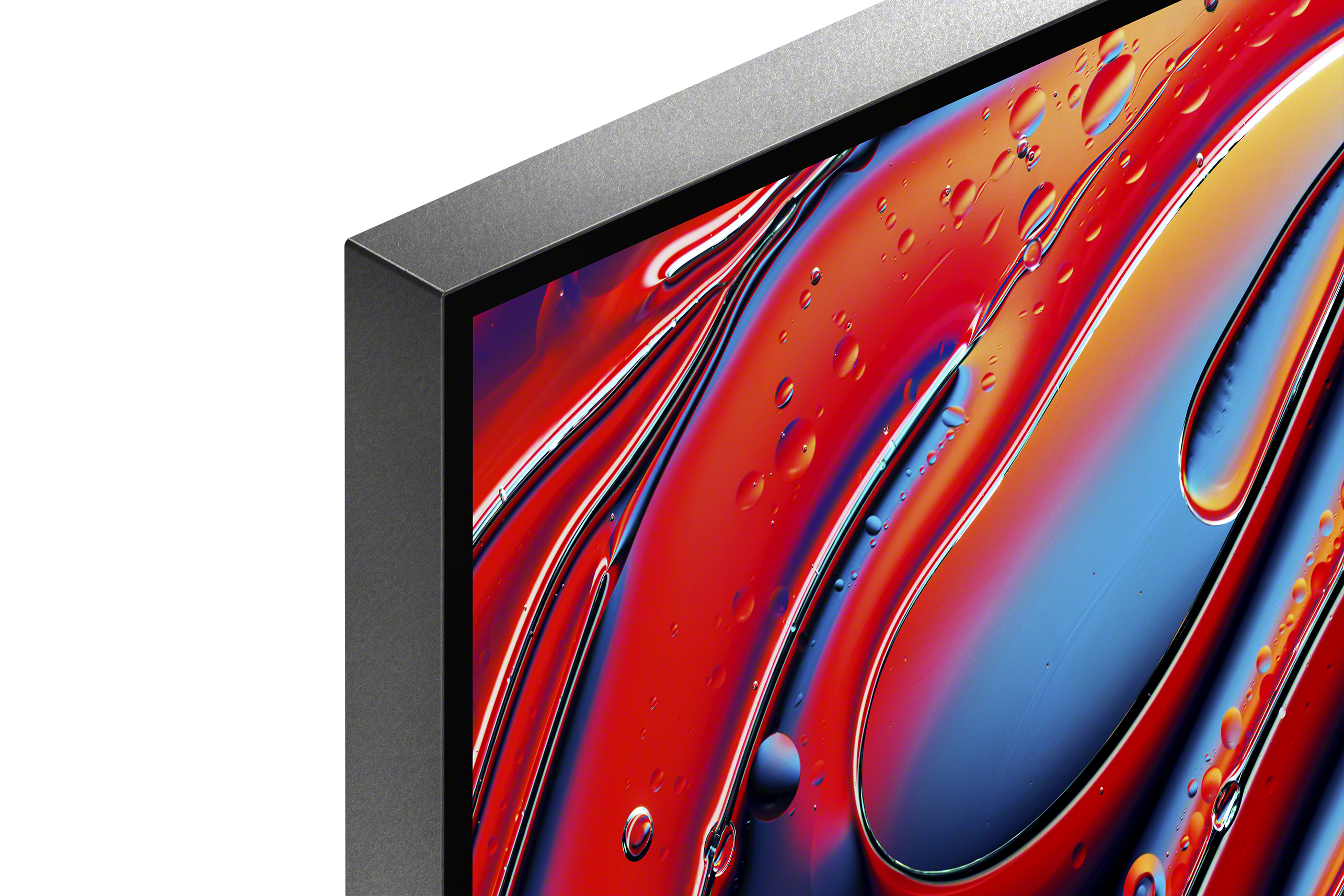 Gros plan d'un coin d'écran de télévision affichant un design abstrait coloré avec effets liquides.