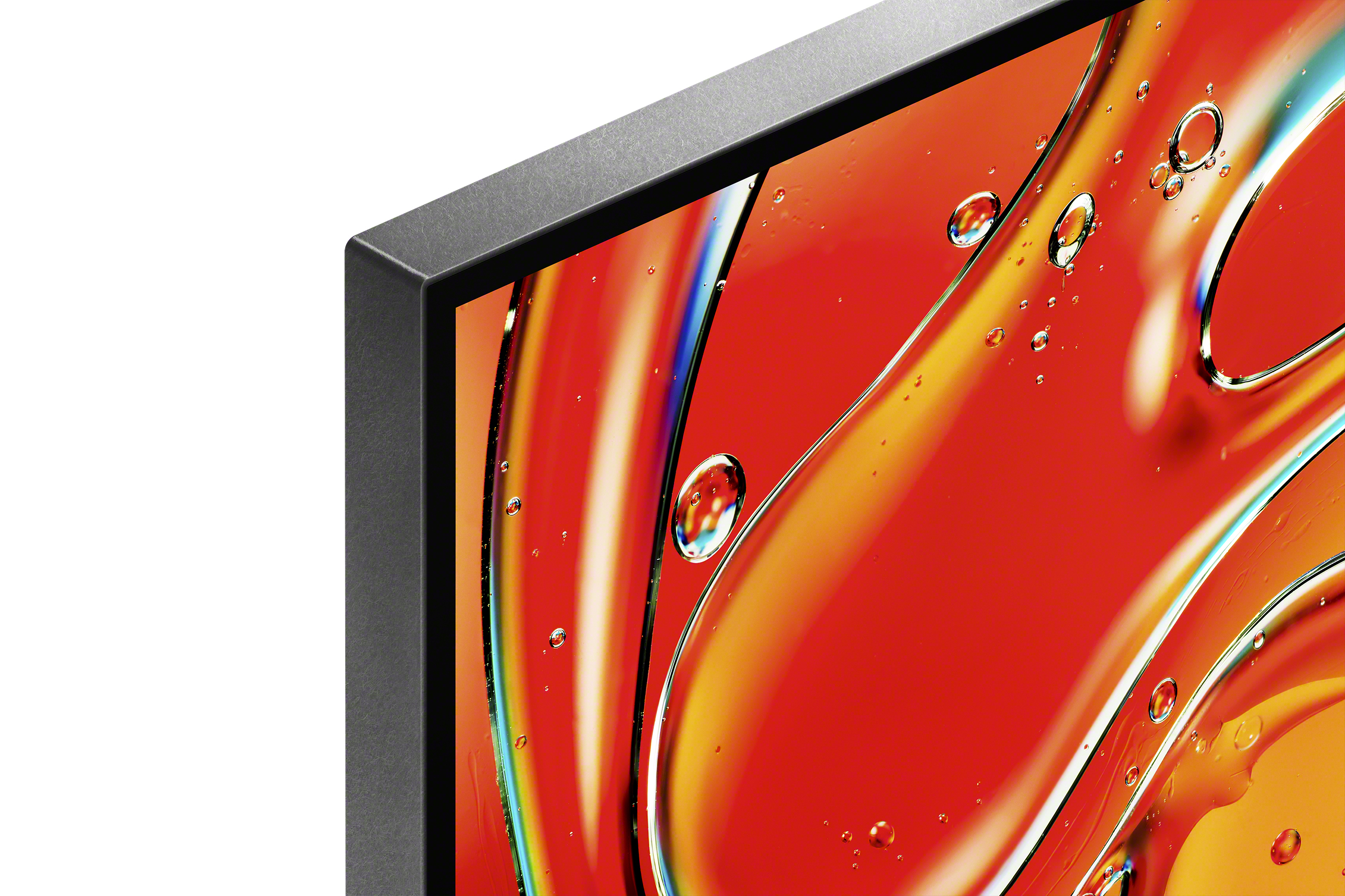 Zbliżenie rogu telewizora, czarna ramka, czerwony i żółty abstrakcyjny wyświetlacz.