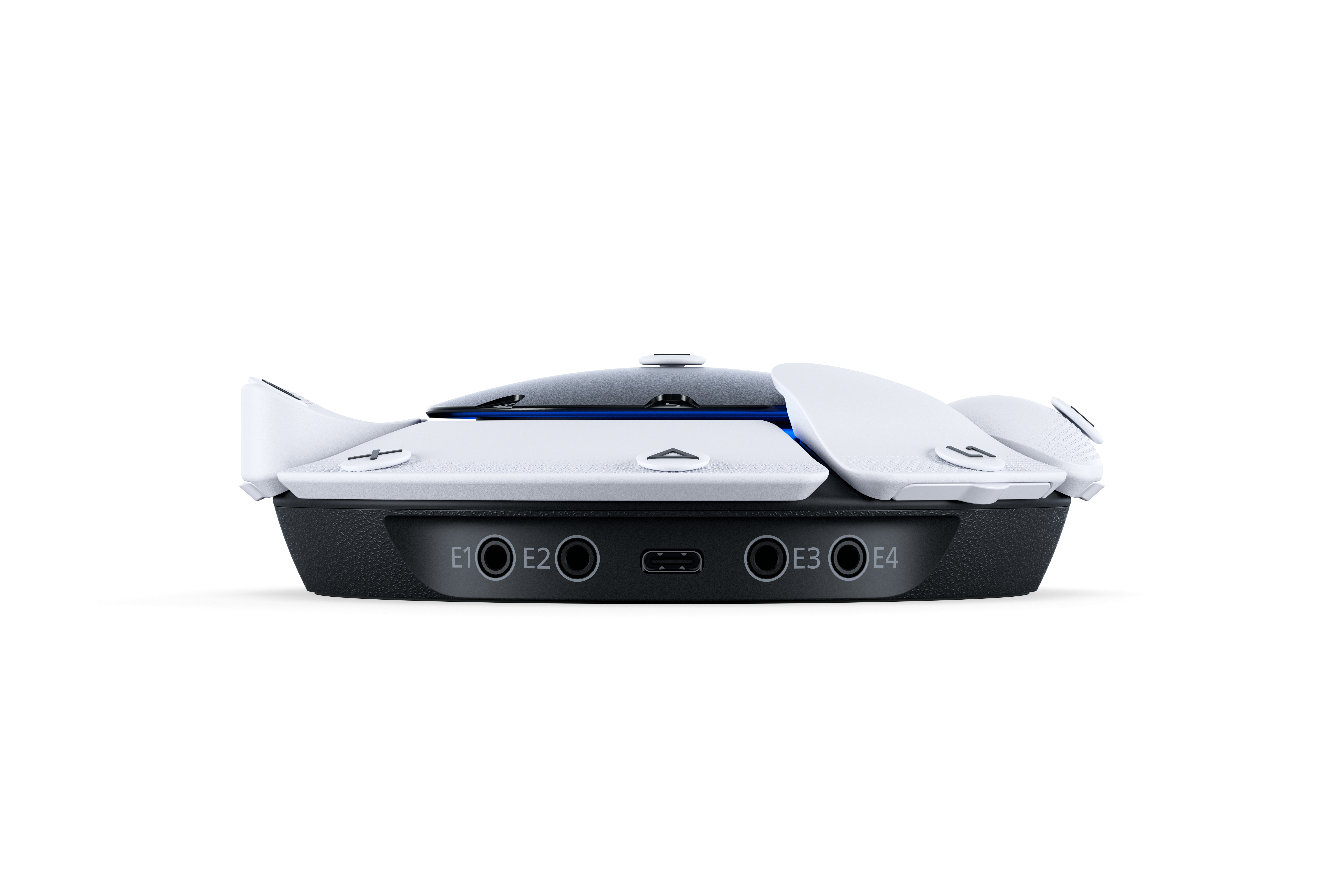 Ein schwarz-weißer Controller mit mehreren Eingangsanschlüssen an der Unterseite.