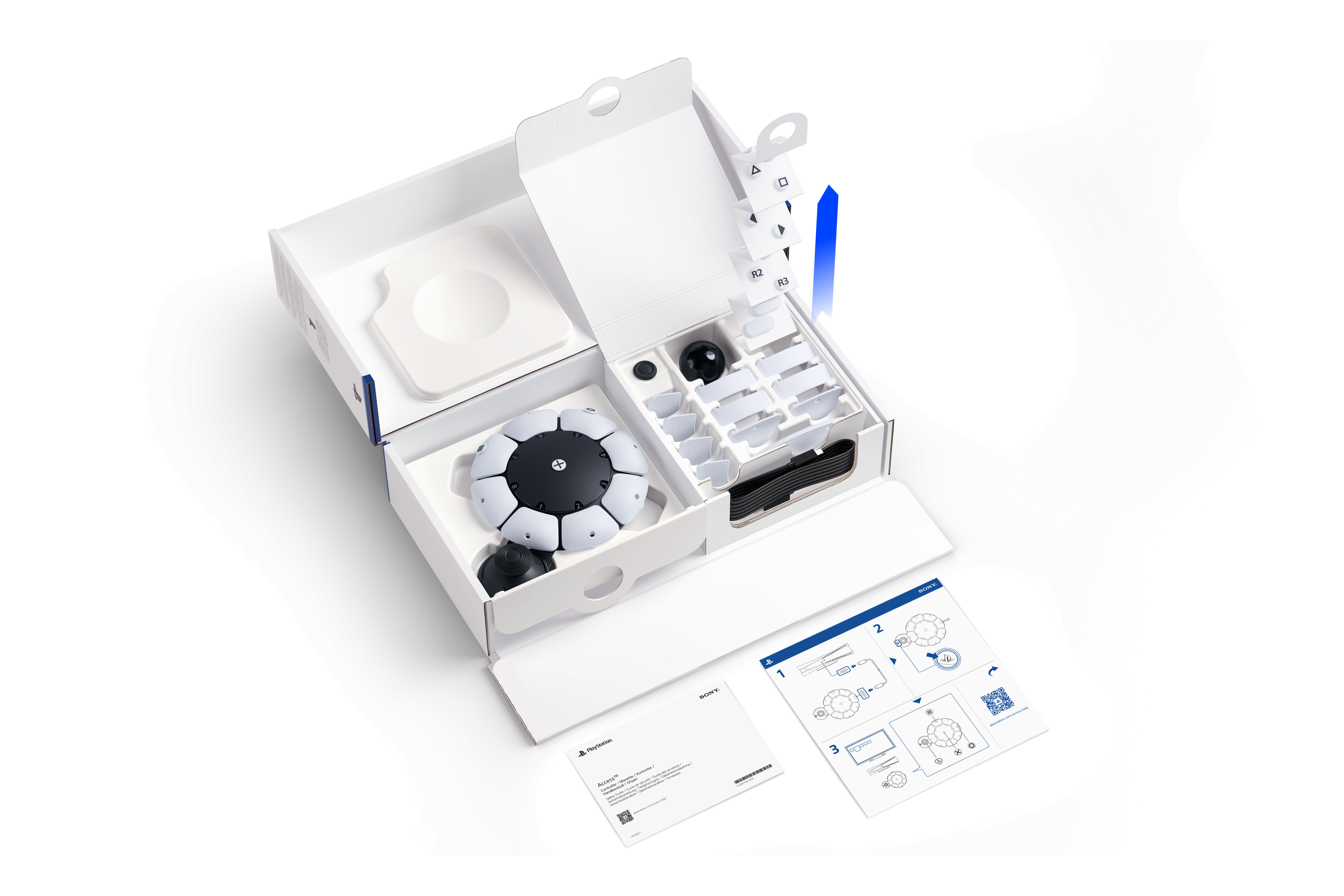 Geöffnete Box mit Komponenten, darunter ein rundes Gerät mit Lichtern.