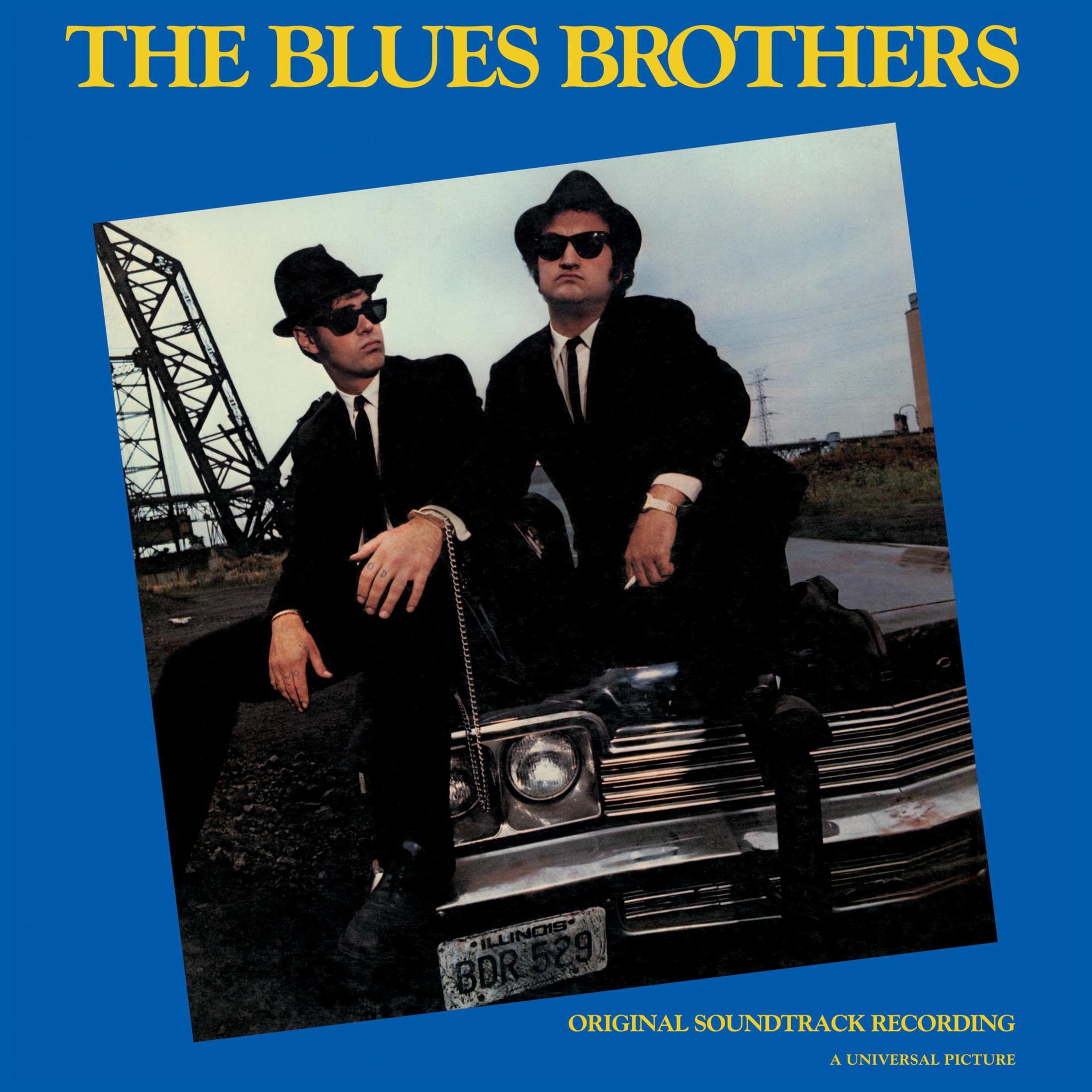 Copertina dell'album: Due uomini in abiti e cappelli neri, su un'auto. Album: The Blues Brothers.