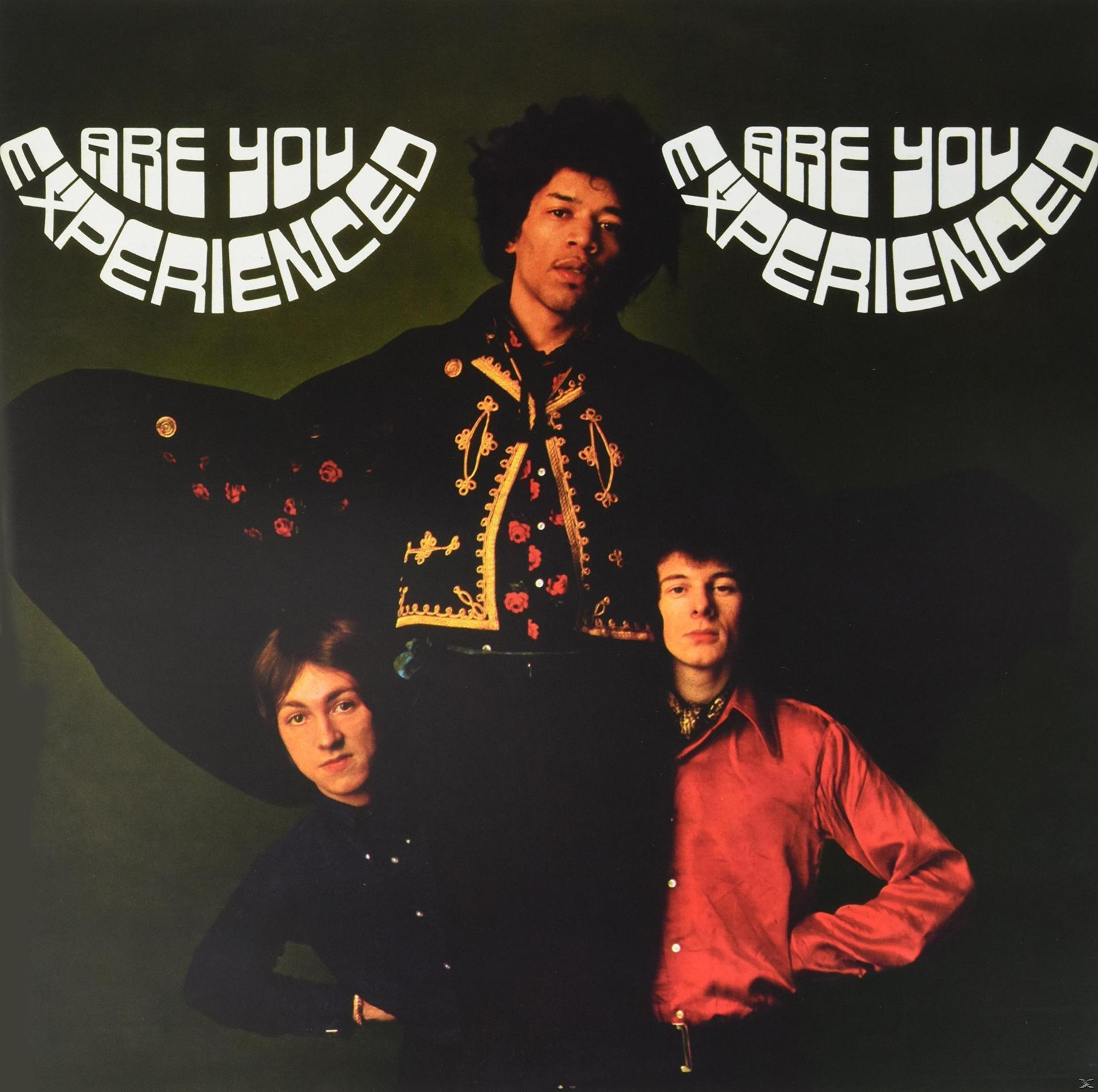 Okładka albumu z trzema mężczyznami, jeden pośrodku w ciemnym płaszczu, tekst: Are You Experienced, The Jimi Hendrix Experience.