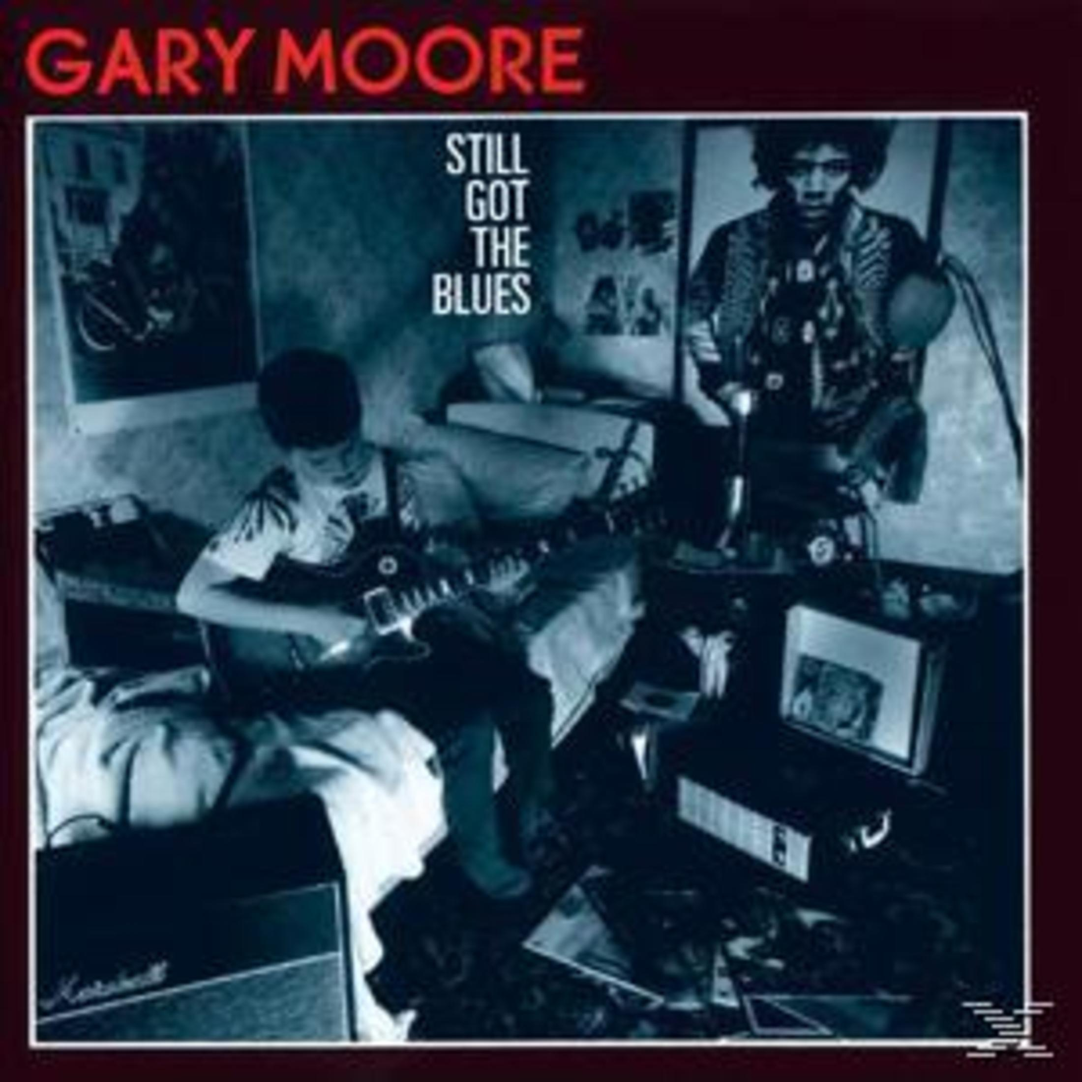 Gary Moore albumhoes. Man speelt gitaar in kamer met posters en kleine versterker.