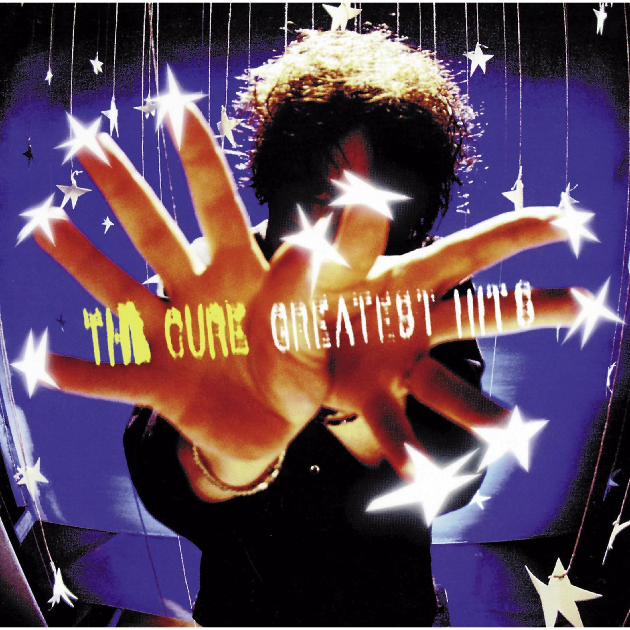 Copertina dell'album con un uomo che si protende verso lo spettatore, circondato da stelle. The Cure.