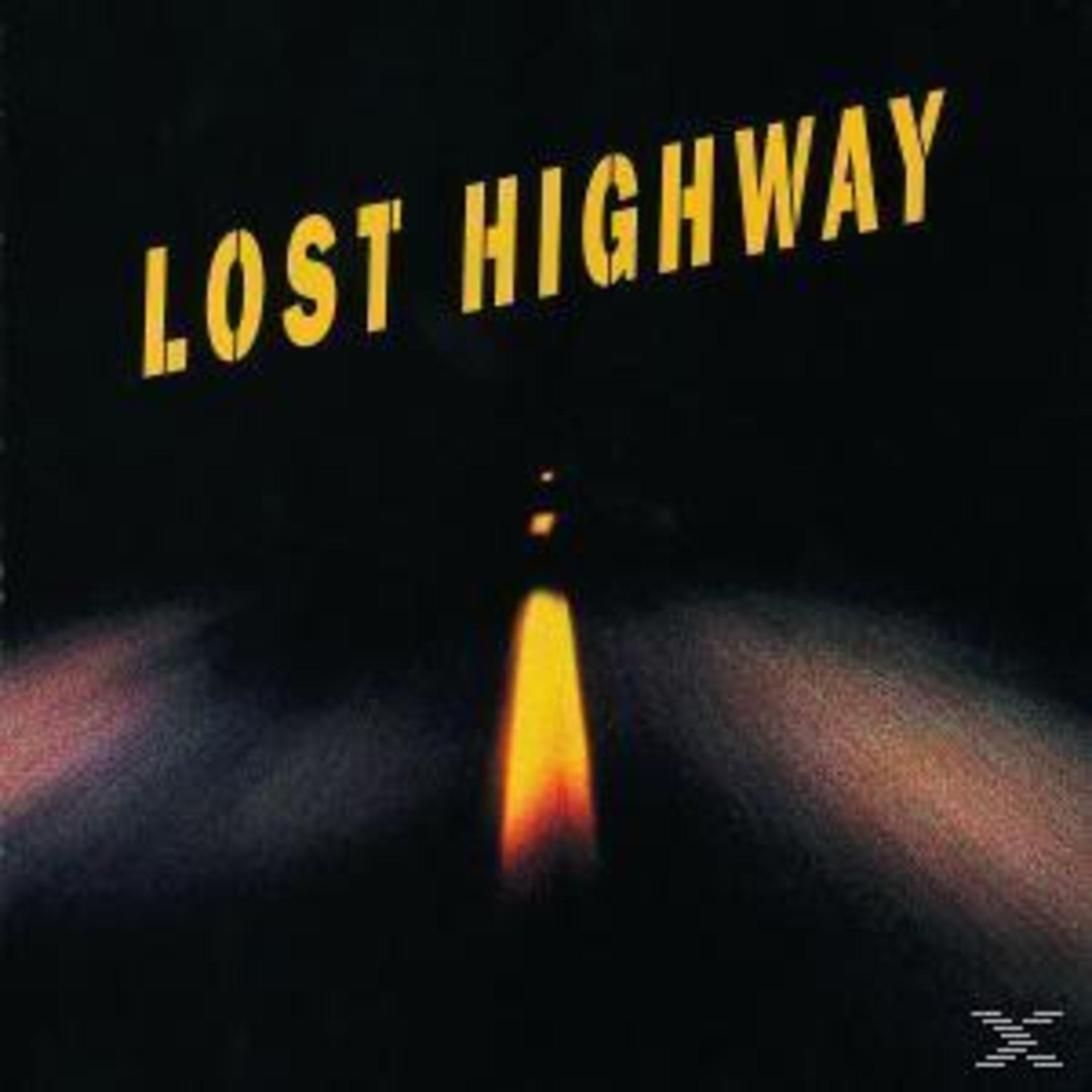 Copertina dell'album Lost Highway. Un'autostrada con una luce brillante alla fine del tunnel.