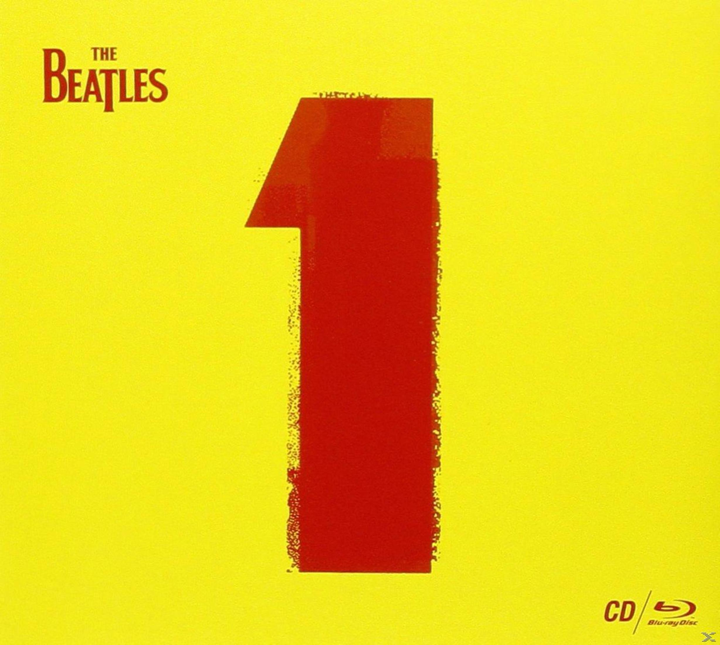 Copertina dell'album: Il logo dei Beatles e un grande numero uno rosso su sfondo giallo, con CD e Blu-ray.