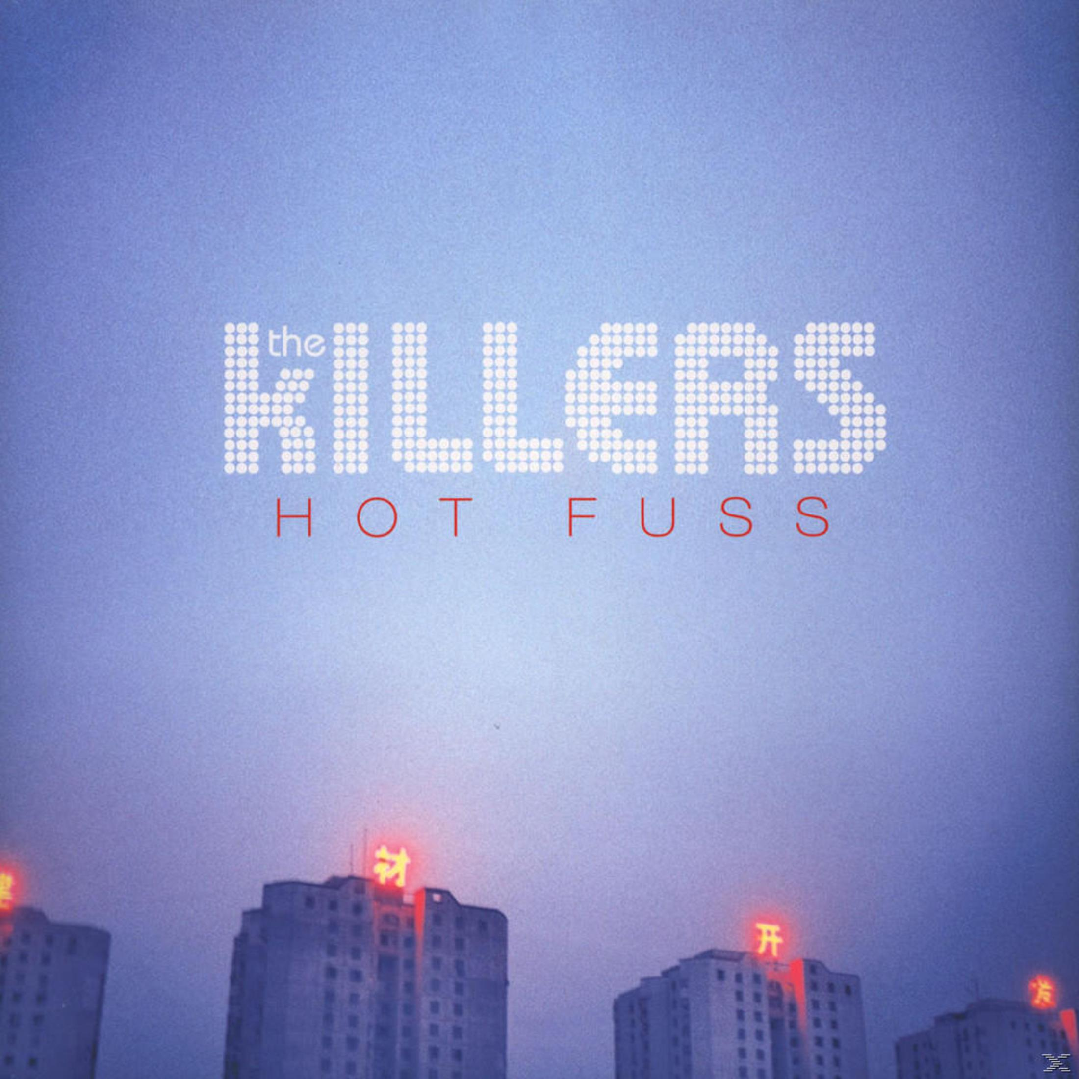 Copertina dell'album con la parola 'KILLERS' in luci sopra gli edifici.