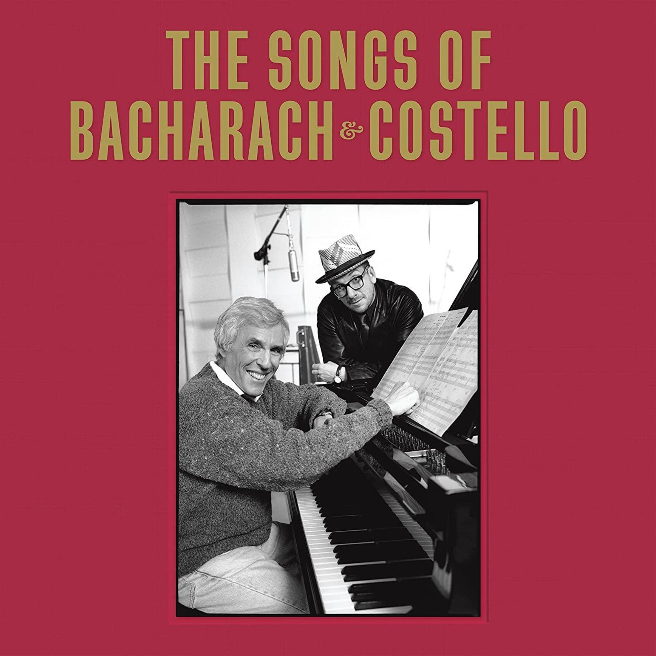 Copertina dell'album con due uomini al pianoforte. La copertina è rossa, con testo in alto e in basso.