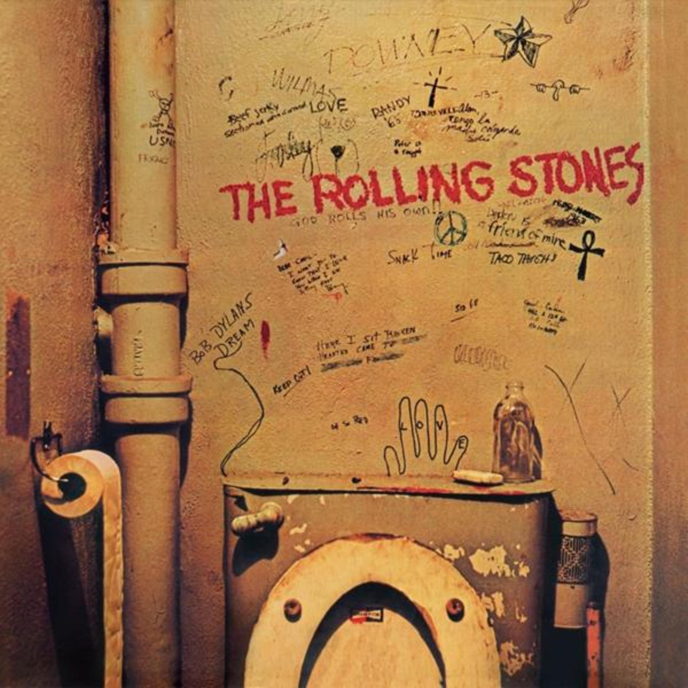 Copertina dell'album: Un muro sporco con graffiti, un gabinetto e le parole 'The Rolling Stones'.