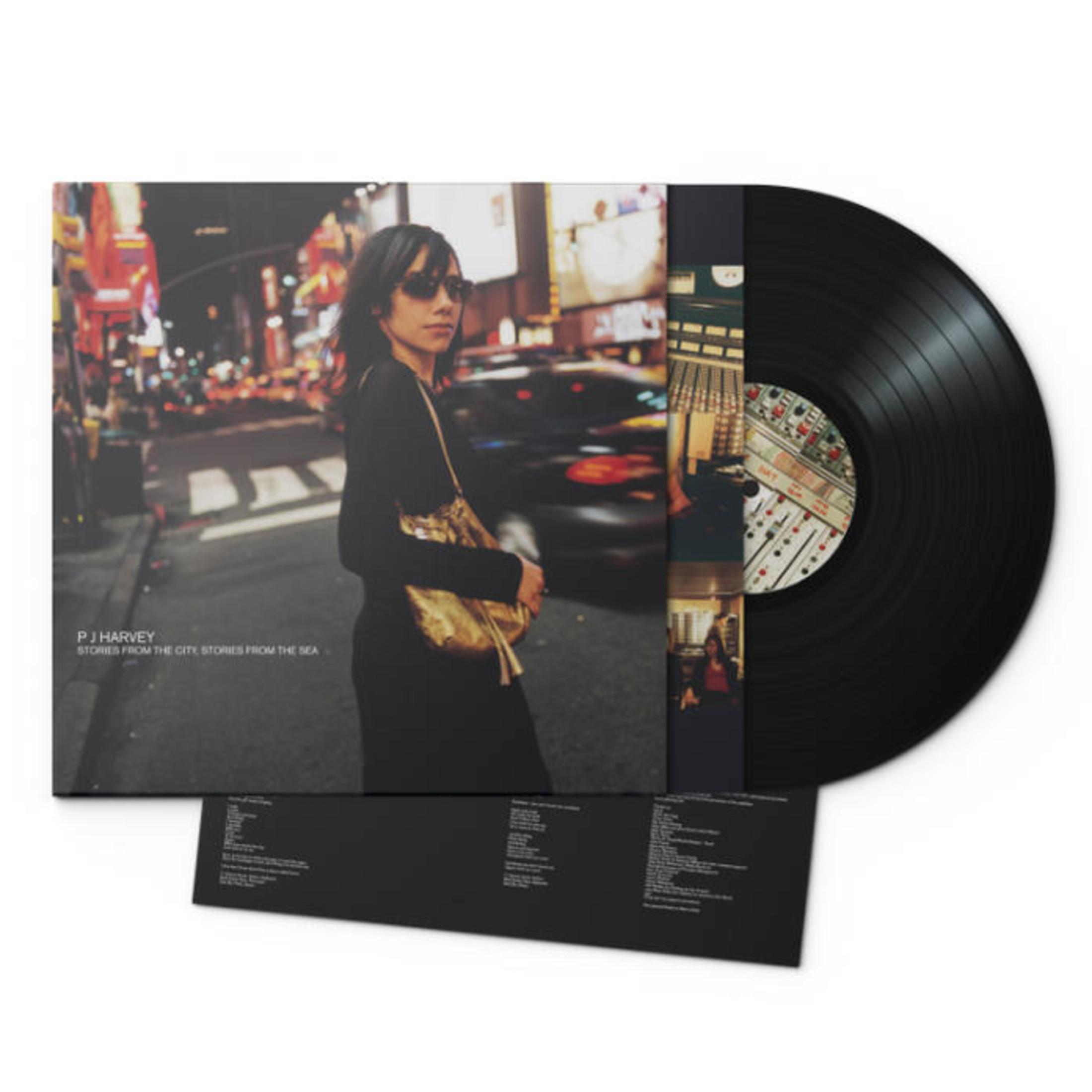 Portada del álbum con mujer, luces de la ciudad y disco de vinilo.
