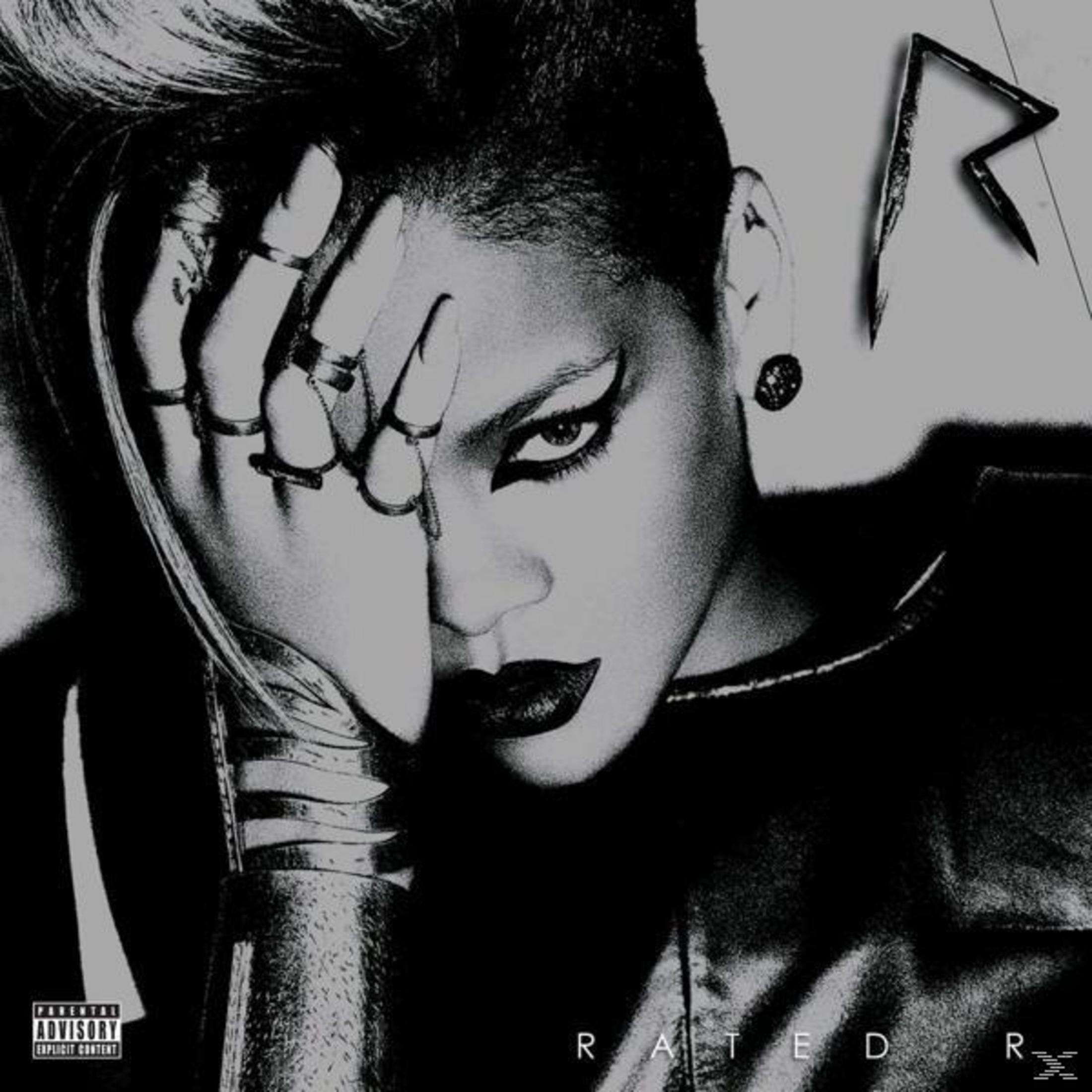 Copertina dell'album: Il volto di Rihanna con trucco nero, mano sul volto. Sfondo nero.