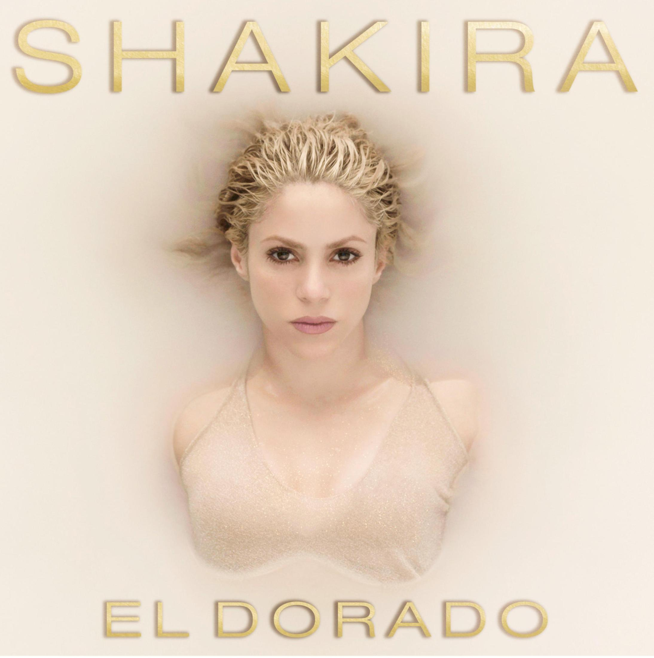 Shakira w wodzie, widoczna głowa i ramiona. Złoty tekst 'Shakira' i 'El Dorado' na górze i na dole.