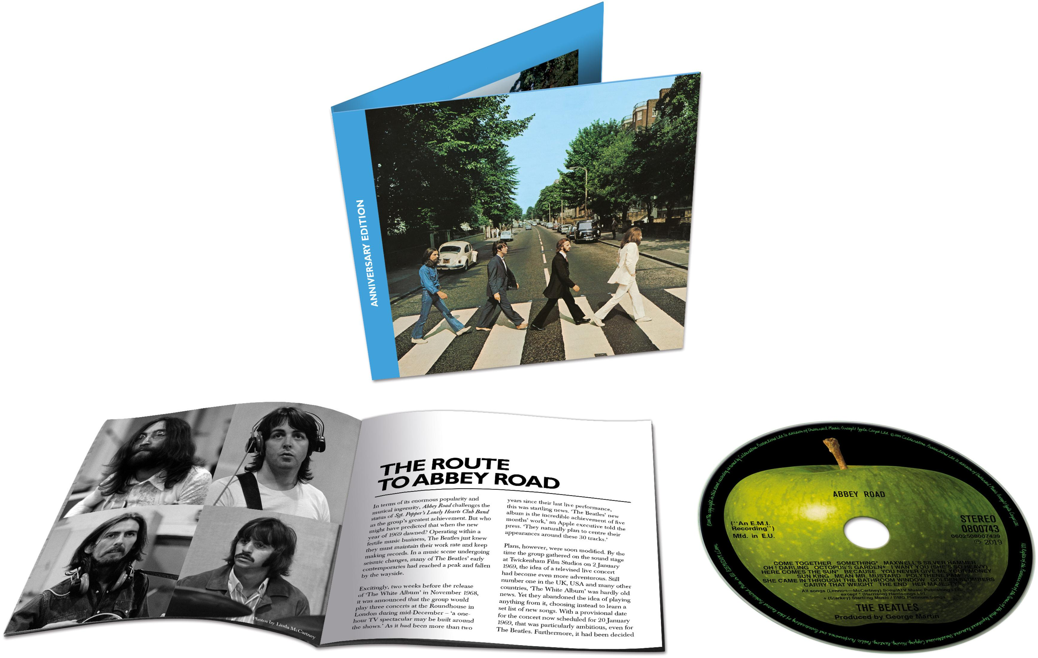 Album Abbey Road. I Beatles che attraversano una strada. Libretto e custodia del CD.