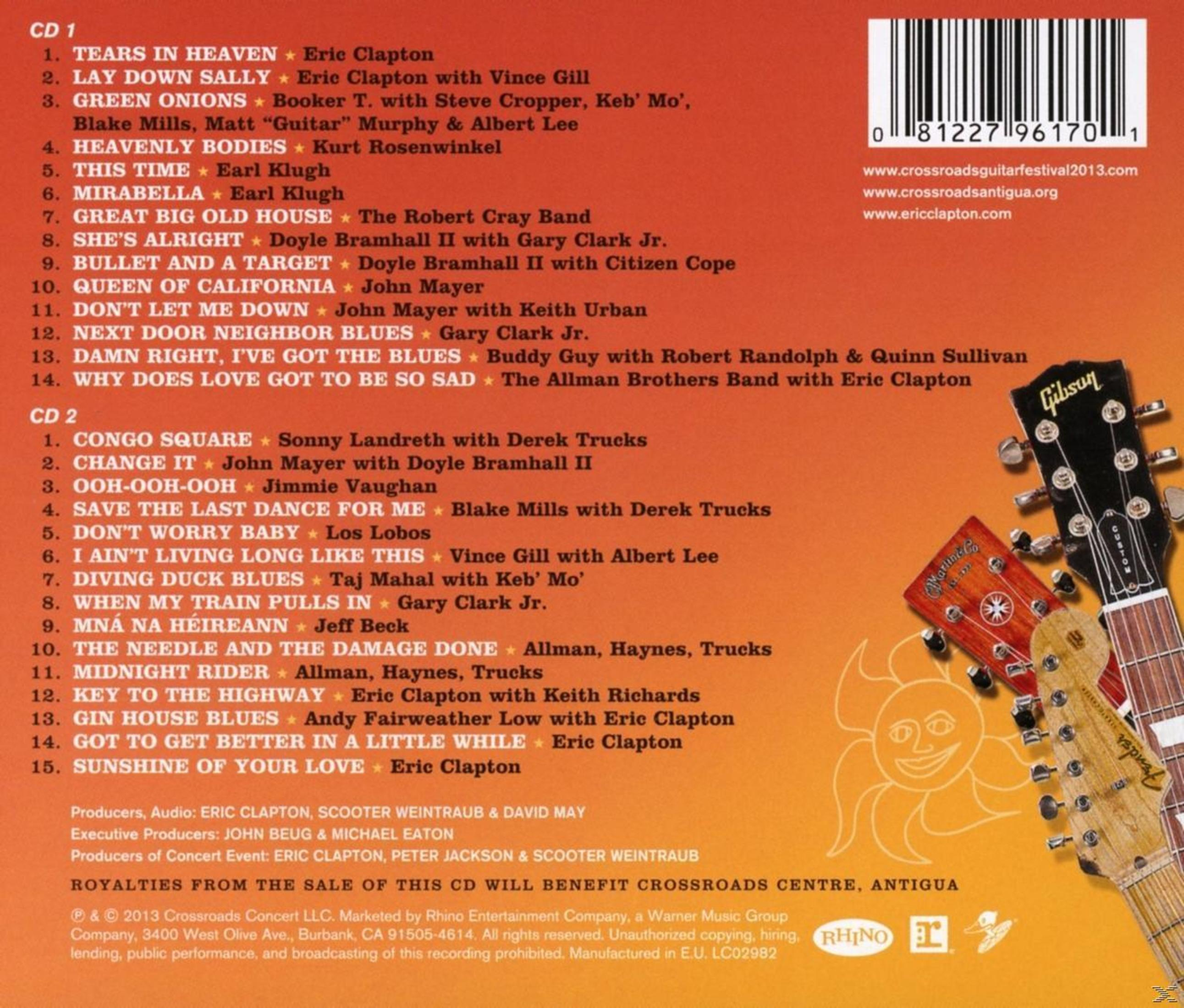 Tracklist CD e immagini di chitarre. Elenca brani e crediti con due chitarre a destra.
