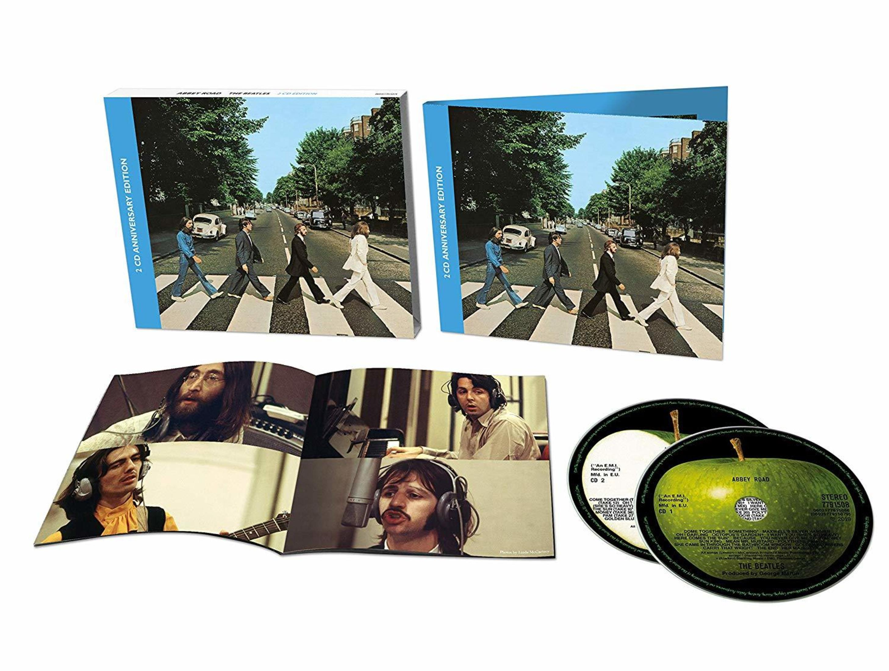 Copertina dell'album con i Beatles che attraversano Abbey Road. Copertina dell'album e custodia del CD aperta, con immagini.