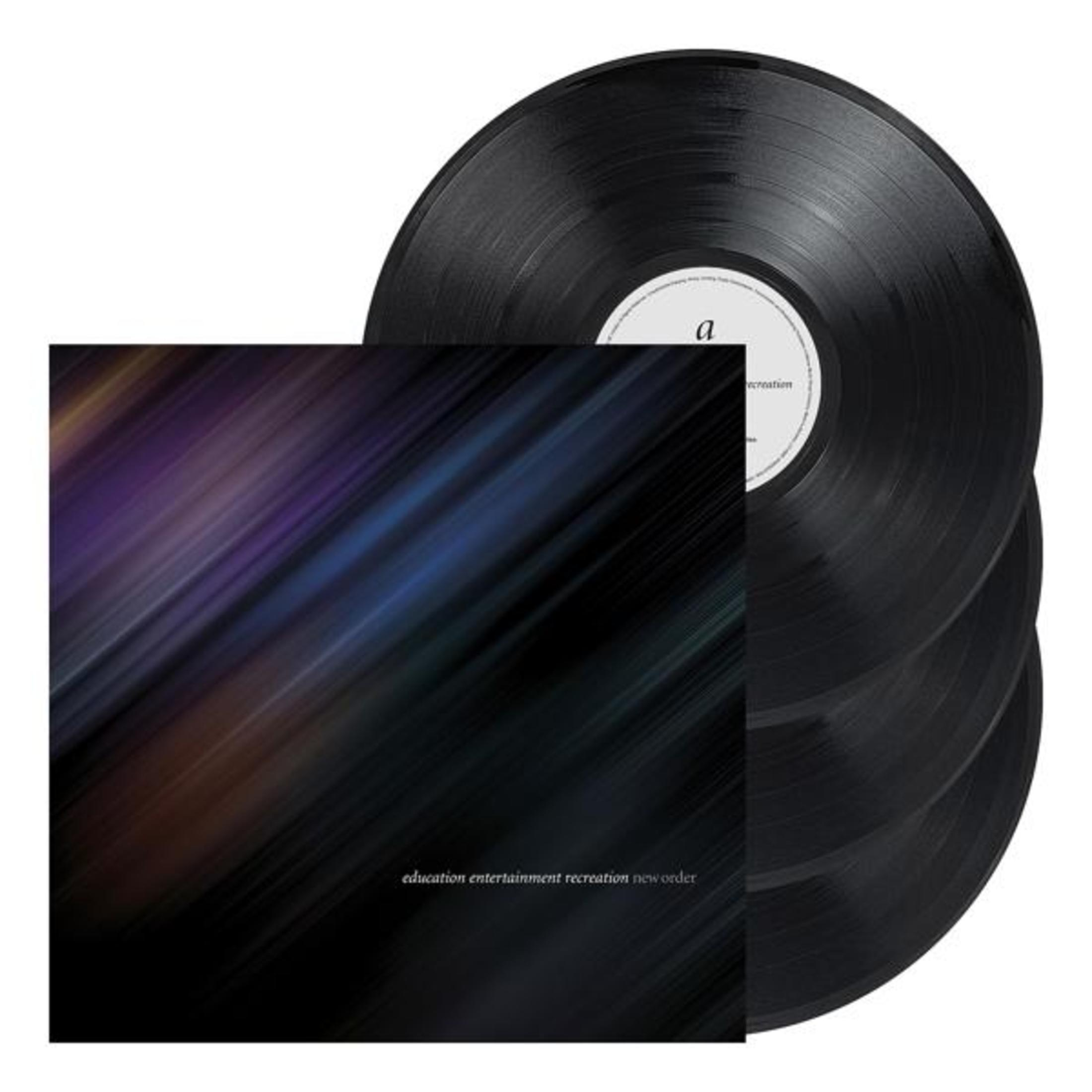 Albumhoes met vier zwarte vinylplaten. De hoes heeft een kleurrijk, abstract ontwerp met tekst.