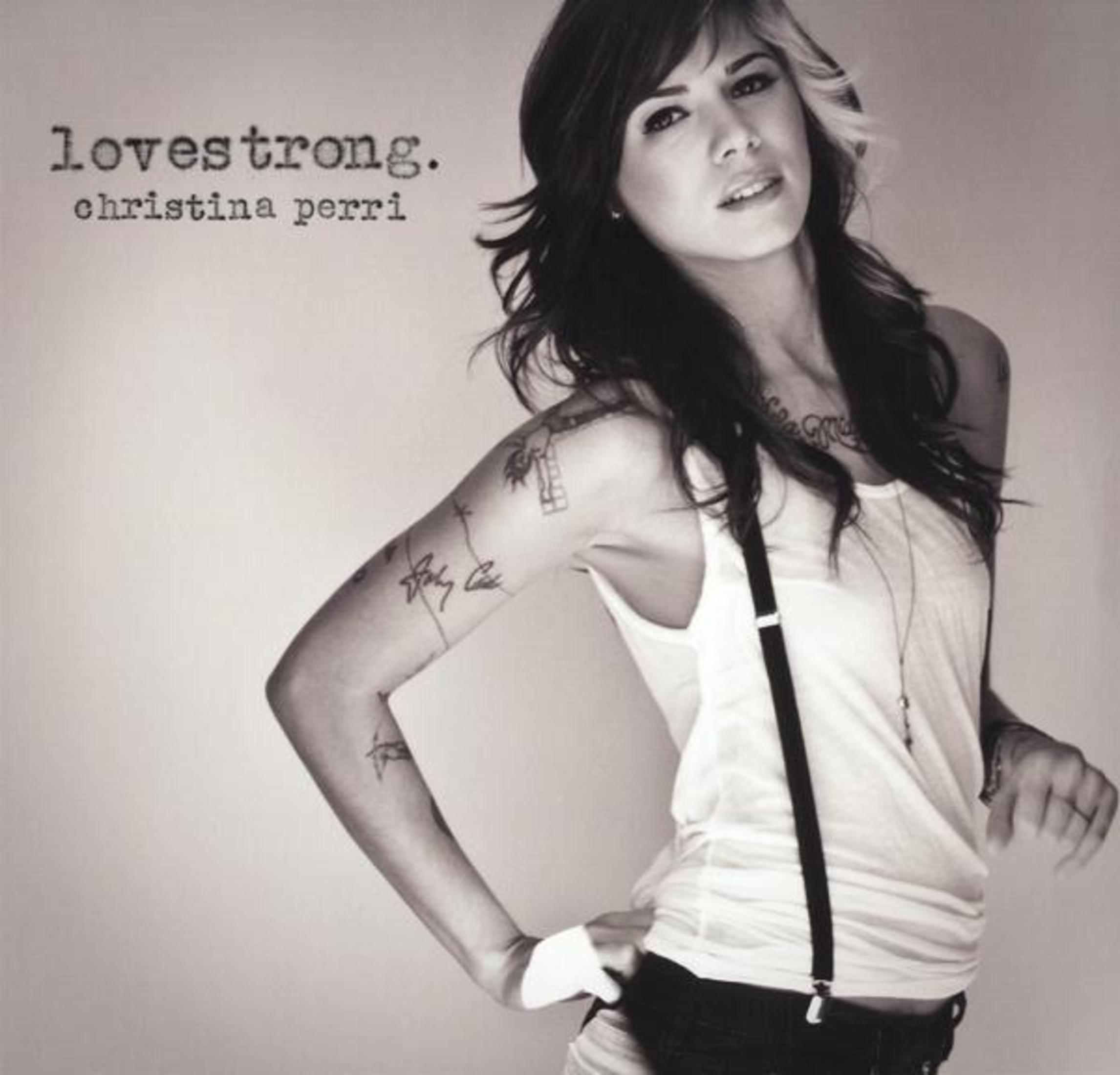 Copertina dell'album di Christina Perri; donna con capelli neri e biondi, in top bianco, guarda verso la fotocamera.