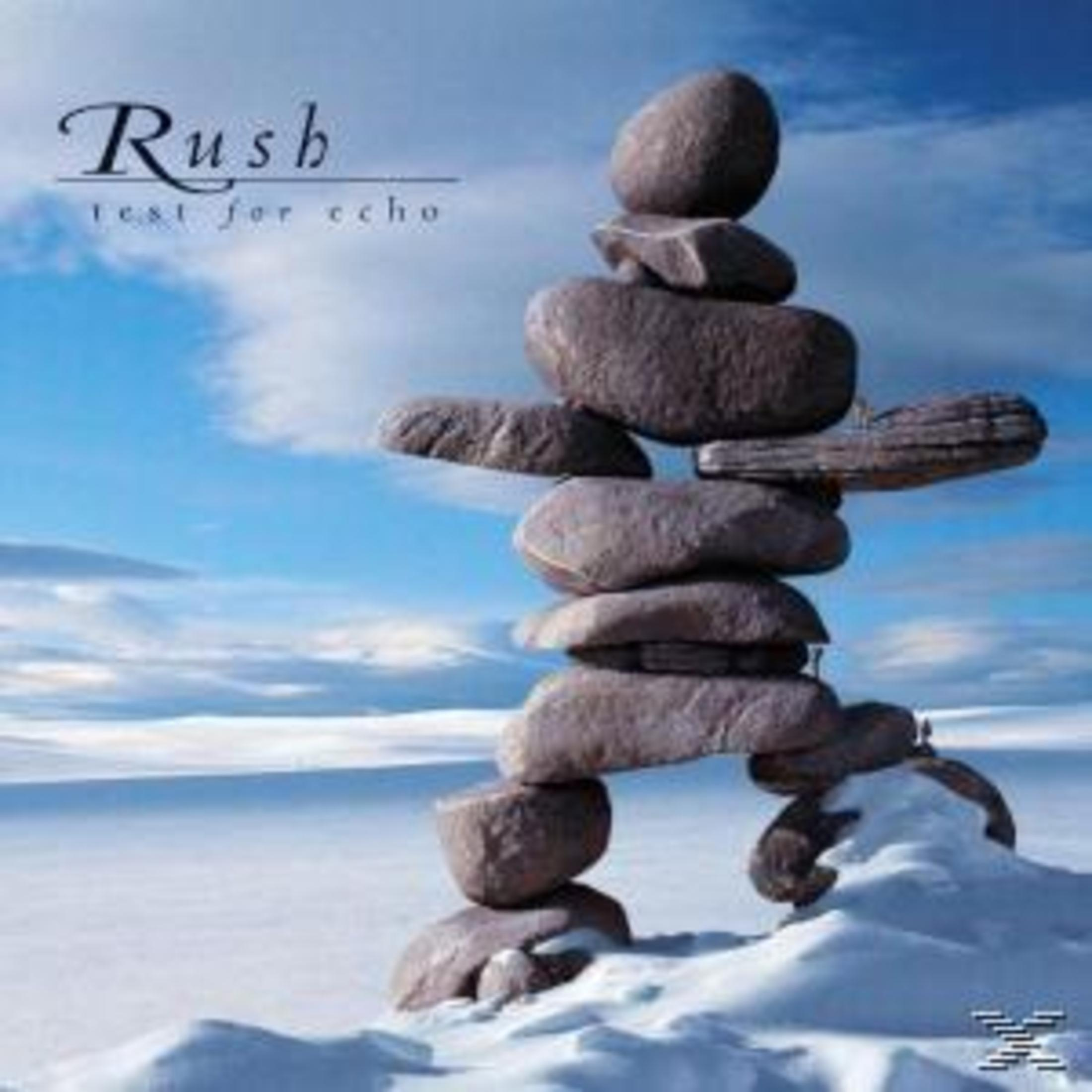 Rush albumhoes. Een stenen structuur op de sneeuw met blauwe lucht.