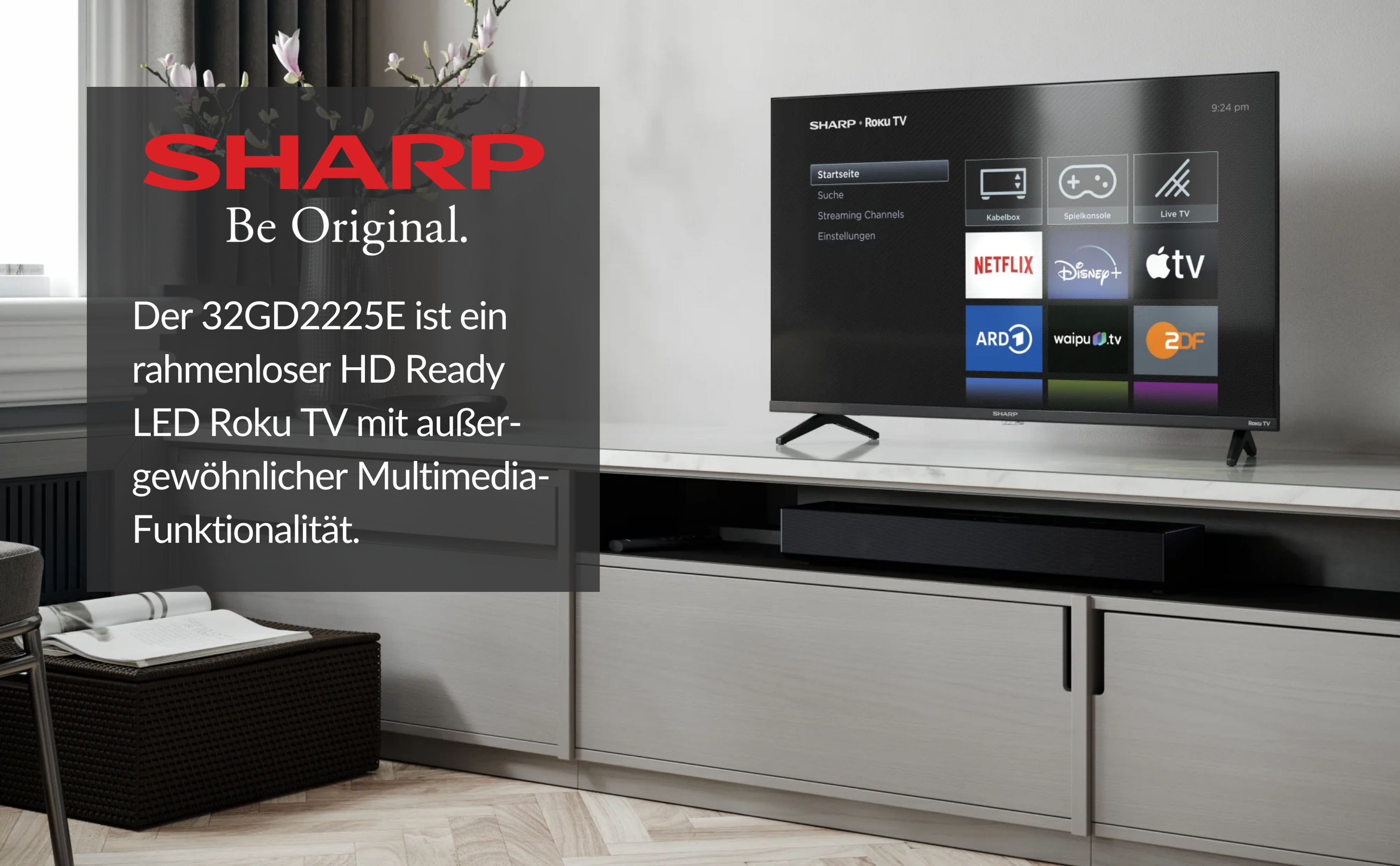 Ein Fernseher auf einem weißen Schrank, mit Text und dem Logo von Sharp.