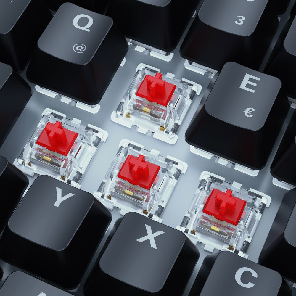 Primer plano de un teclado con teclas negras e interruptores mecánicos rojos. Las teclas son las letras Q, E, Y, X y C.